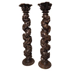 Pareja de columnas salomónicas portuguesas de castaño muy esculpidas, circa 1700