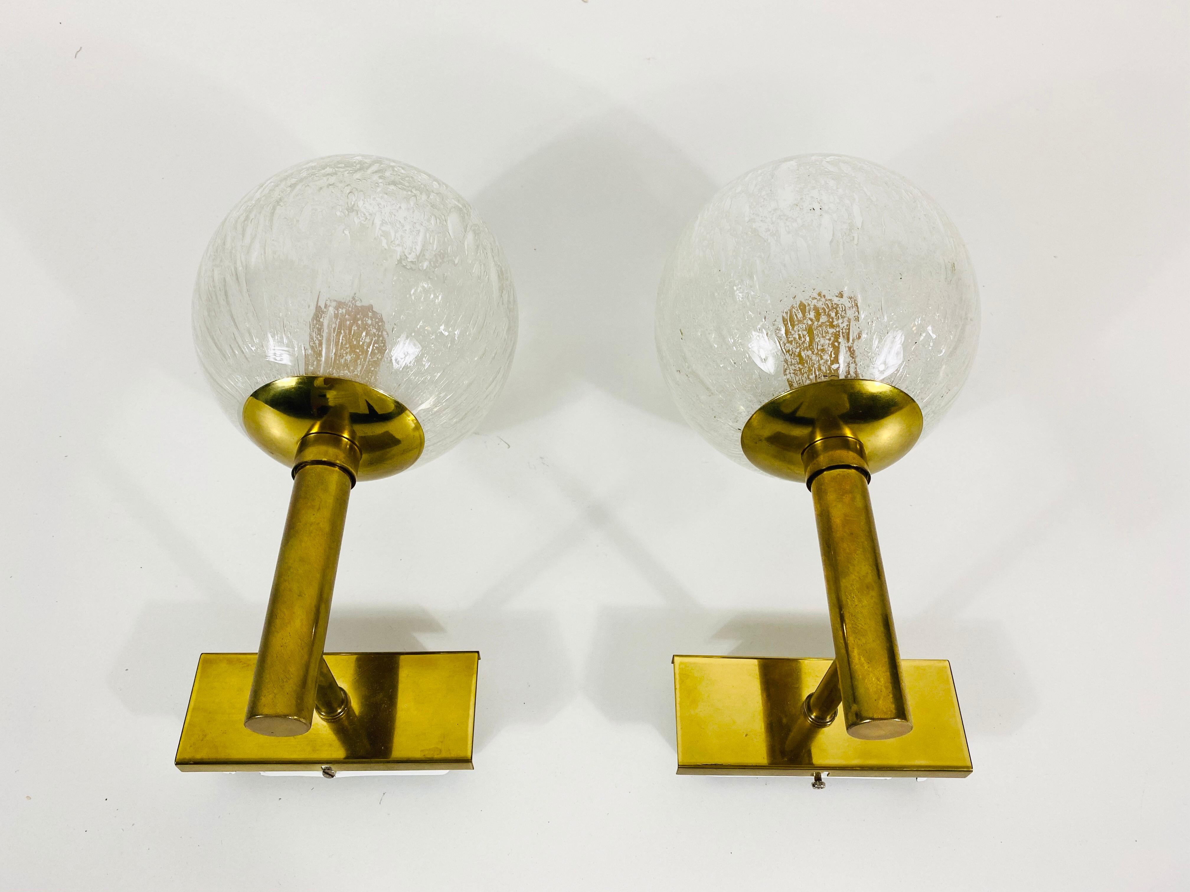 A pair of wall lamps by Hillebrand Leuchten made in Germany in the 1960s. It is fascinating with its rare glass shape. The bottom part of the lamp is made of brass. 


The light requires one E14 light bulb. Very good vintage condition.

Free