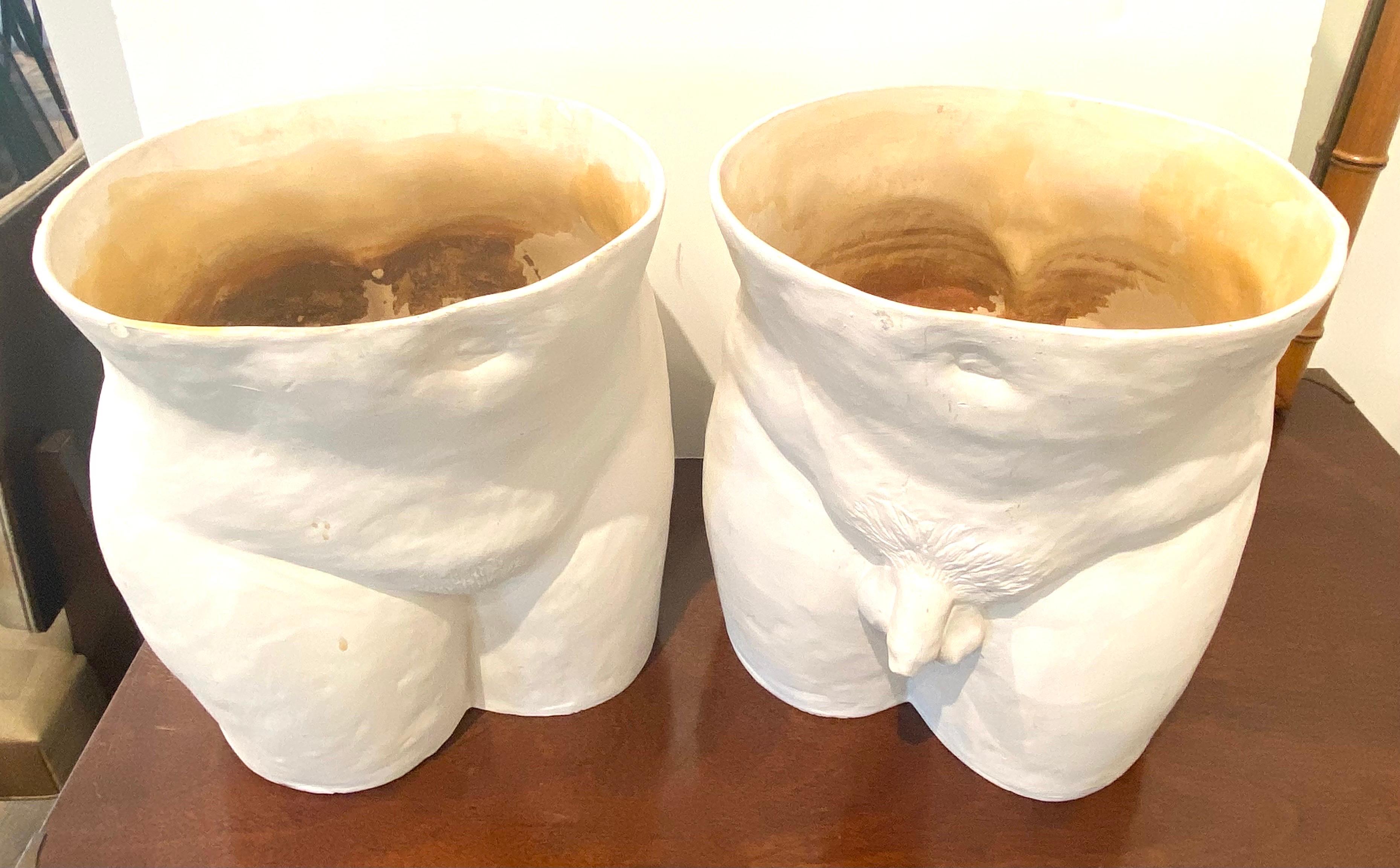 Unique pair of bisque planters. one is of a male buttock and genitalia, the second is of a female buttock and genitalia.