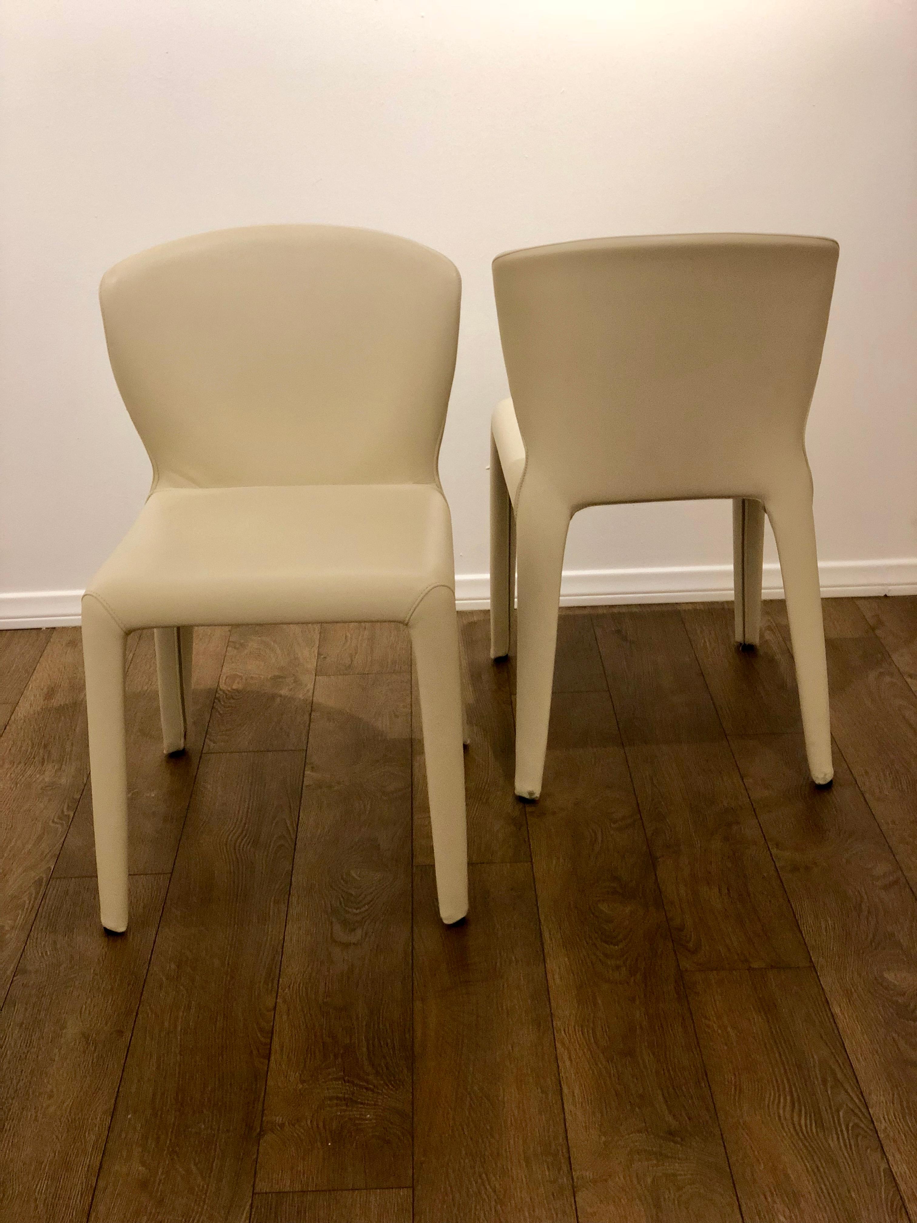 Elegant pair of chairs designed by Hannes Wettstein for Cassina in cream color leather , nice and clean condition , retain its labels beautiful simple design and great quality solid , comfy and sturdy . Made in Italy circa 2000.