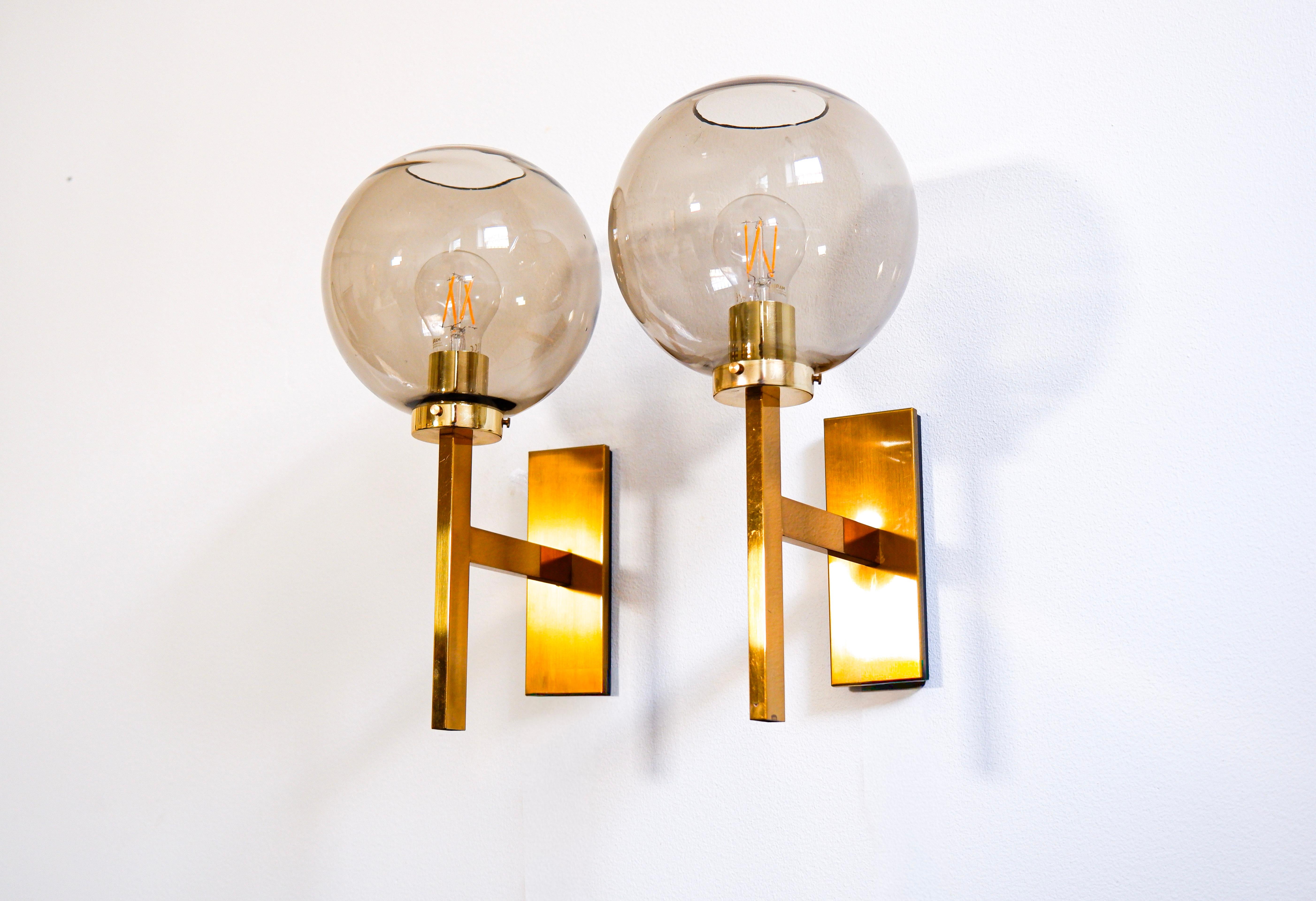 Brass Pair of Holger Johansson wall lamps for westal circa 1960. For Sale