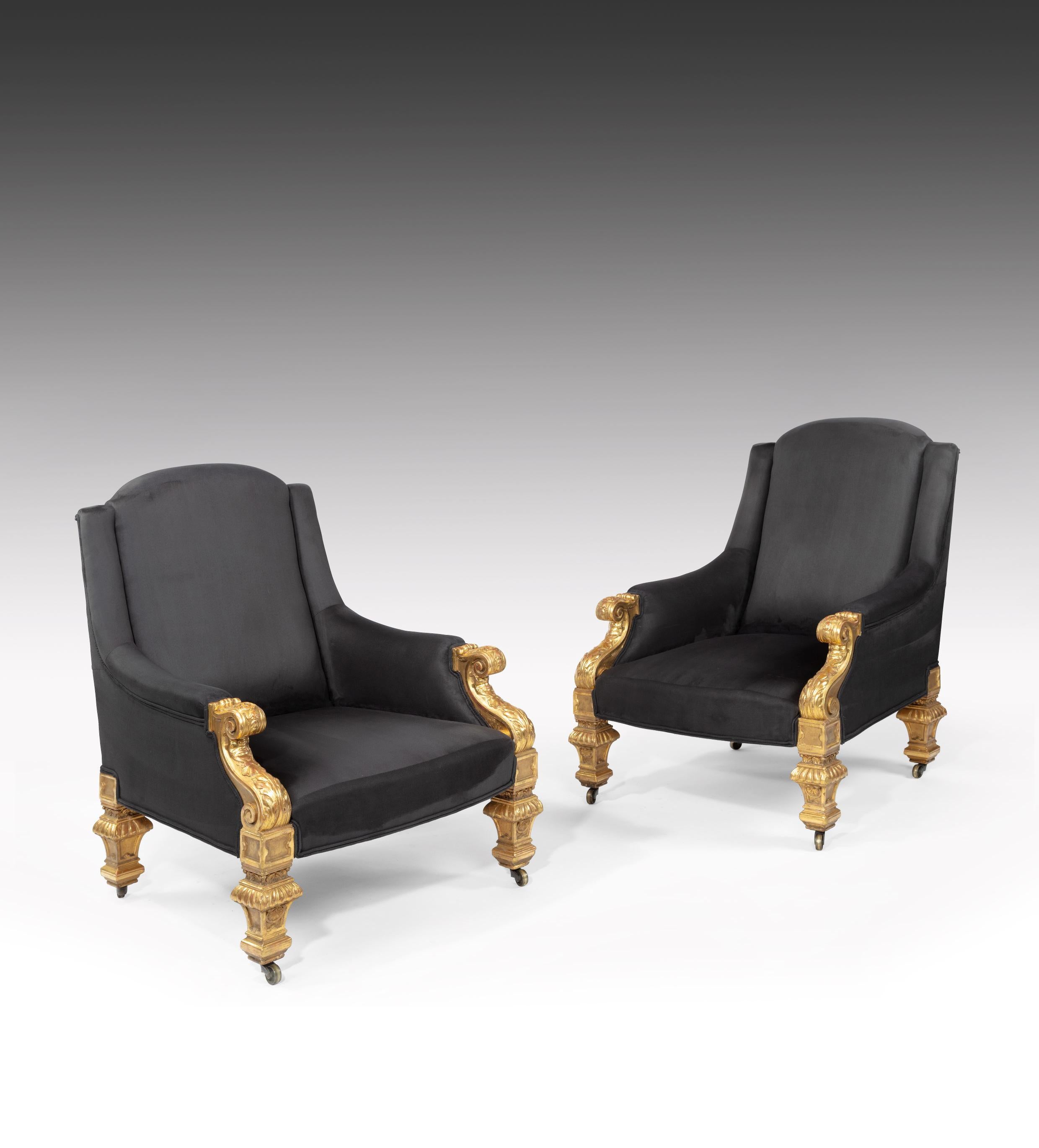 A superb pair of mid-19th century Victorian giltwood armchairs attributed to Holland & Sons.

English, circa 1860.

The arched rectangular shaped back above a sprung seat and rising padded armrests, each having carved scrolled terminals to the