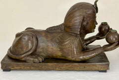 Pair of Hollow-Cast Bronze Egyptian Revival Sphinx Torchères, American C 1920s