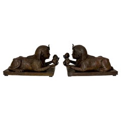 Pair of Hollow-Cast Bronze Egyptian Revival Sphinx Torchères, American C 1920s