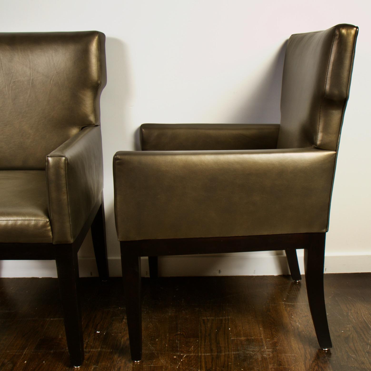 Pair of clean dark khaki green leather armchairs very reminiscent of Christian Liaigre's for Holly Hunt. Dark cappuccino frame with slightly curved, tapered legs.
