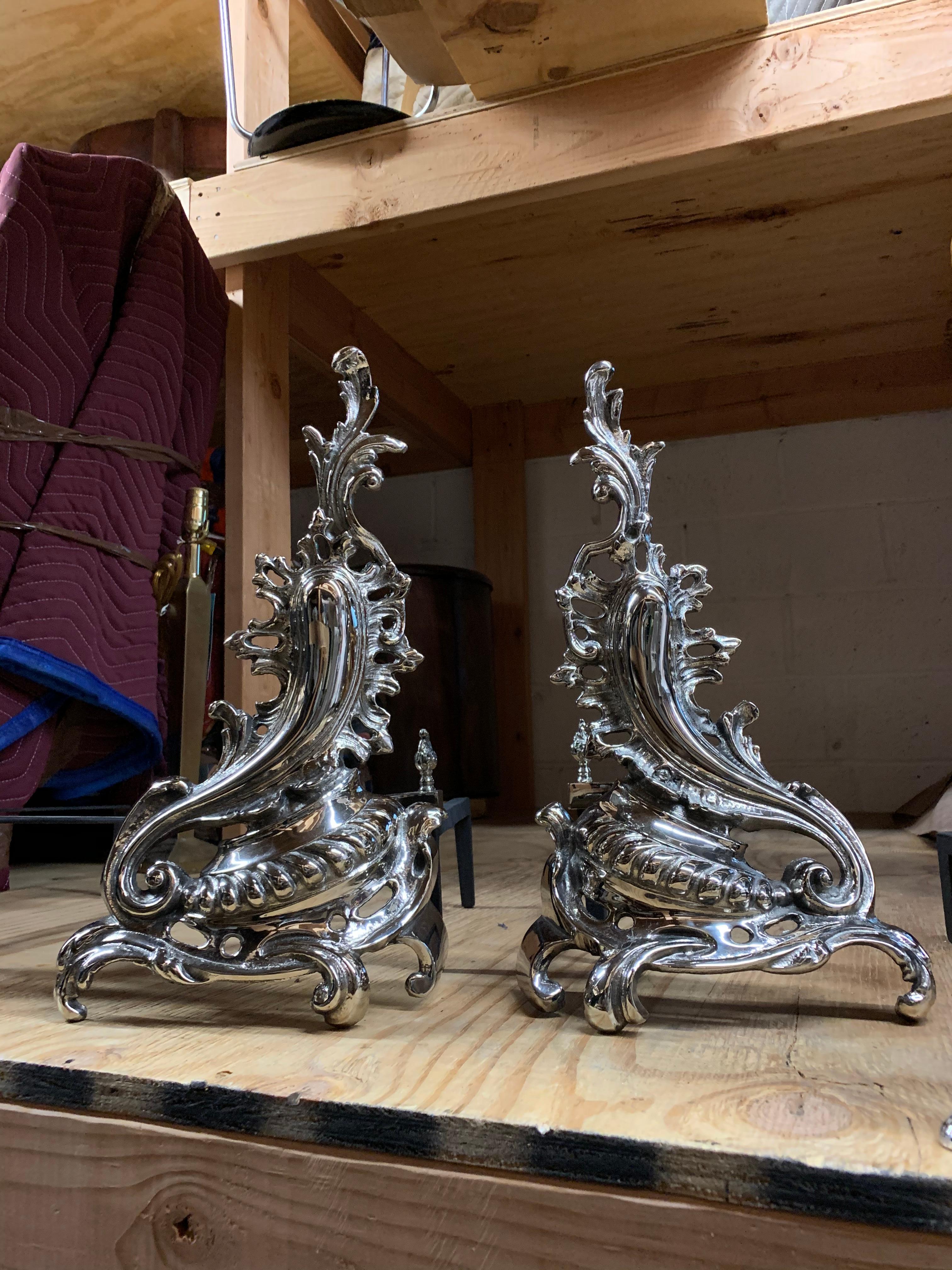 Set of andirons in the shape of flame, fully restored, can be set up to right or left of each other.