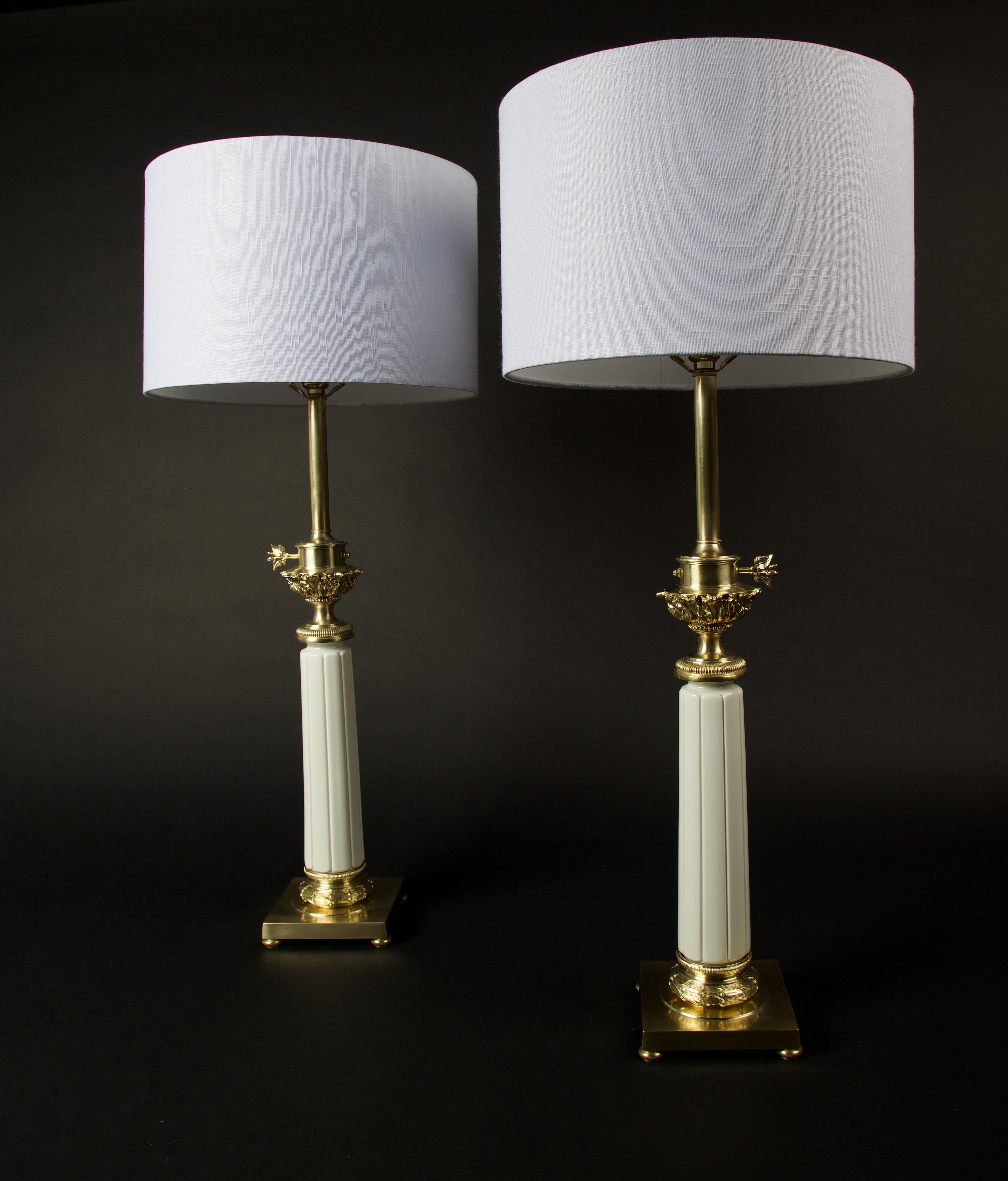 Pair of Hollywood Regency brass and ceramic Stiffel table lamps
Recently professional refinished.
Can go with a in a modern or traditional decor.
Neoclassic in style with a heavy weight solid brass cast and a white ceramic fluted cylinder. Shade