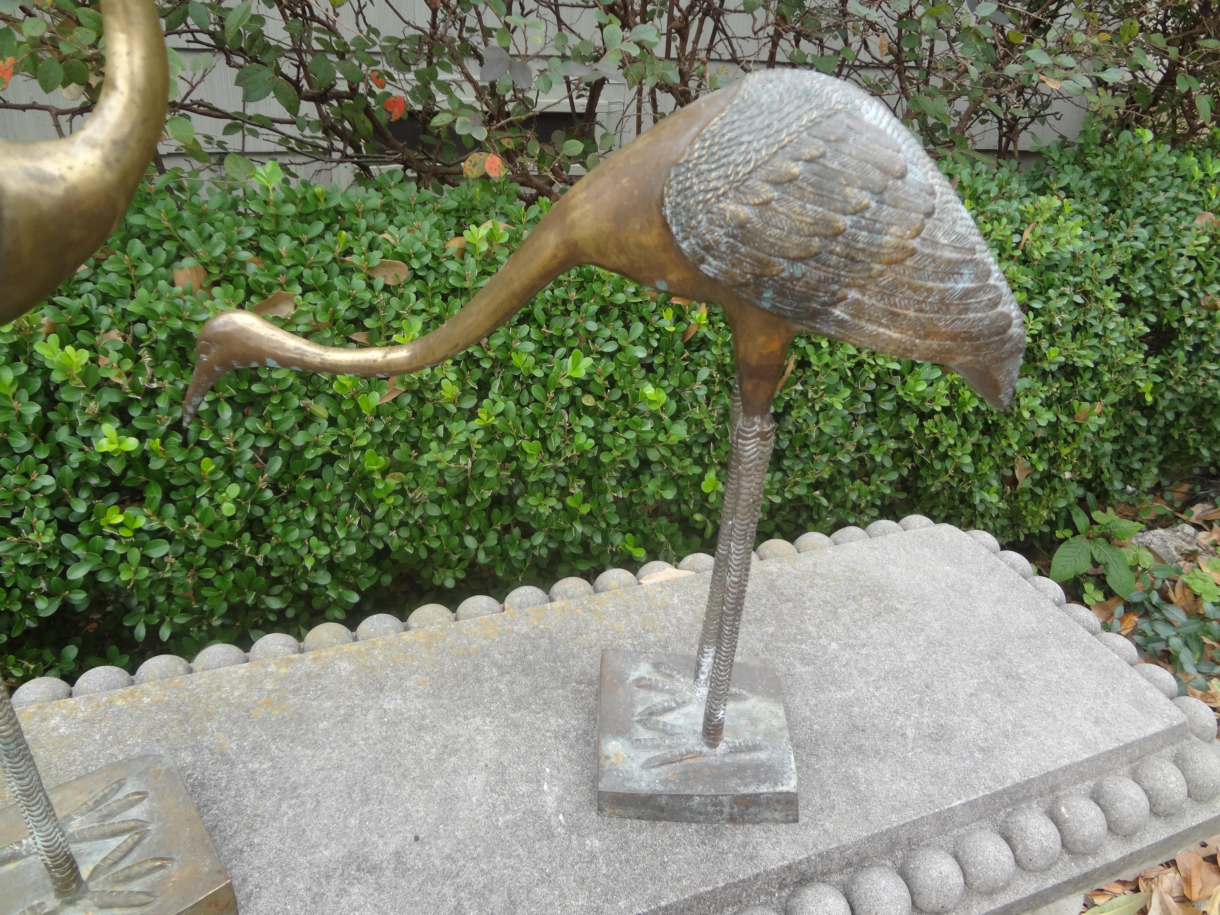 Pair of Hollywood Regency Brass Cranes In Good Condition For Sale In Houston, TX