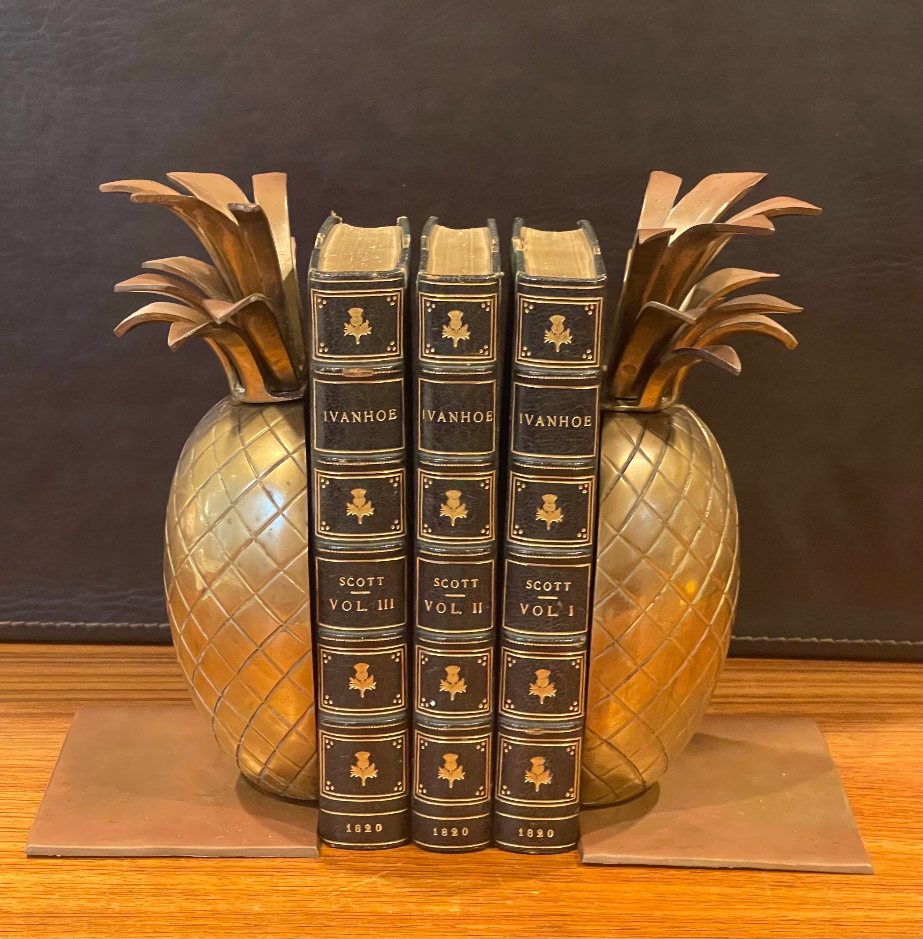 A very nice pair of Hollywood Regency brass pineapple, circa 1970s. The set is in very good vintage condition with a wonderful patina and measures 7.75