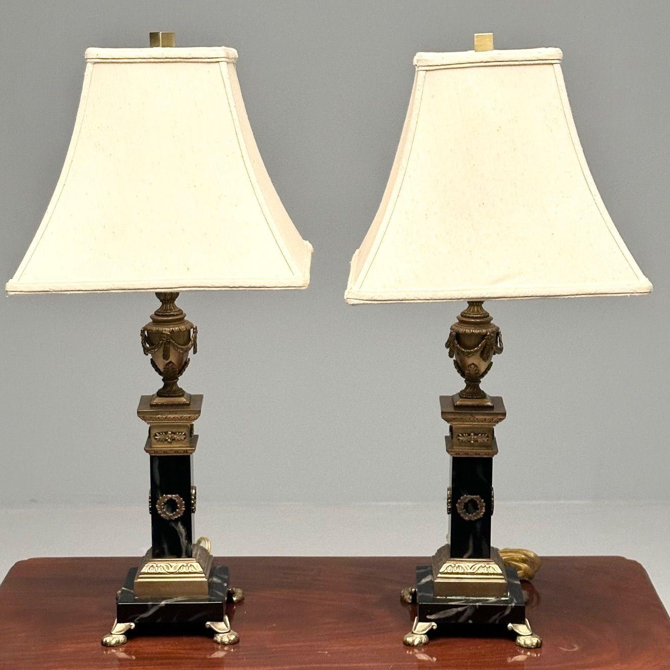Pair of Hollywood Regency Bronze and Marble Table Lamps, Corinthian Column Form

A sweet stylish pair of bronze and marble table lamps, each having a Corinthian column form with wreath and leaf design in bronze on claw feet pedestals. The pair with