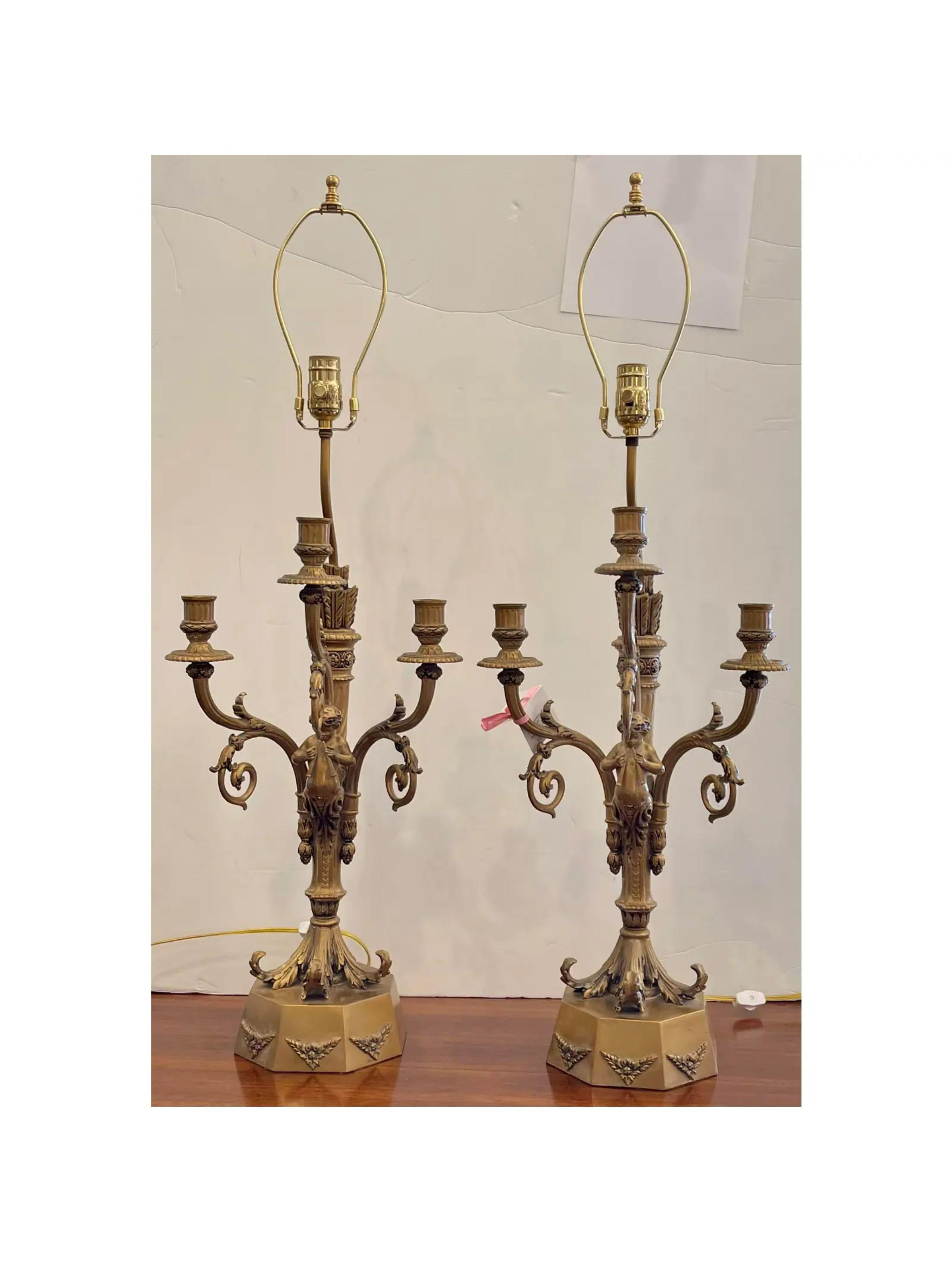 Pair of Hollywood Regency Candelabra Lamps w Trumpet Playing Putti - Paris Foundry. Superb quality painted metal finish, each featuring a Paris makers foundry mark which is illustrated.

Additional information: 
Materials: Bronze, Paint
Color: