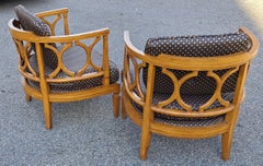 Pair of Hollywood Regency Carved Barrel Back Armchairs