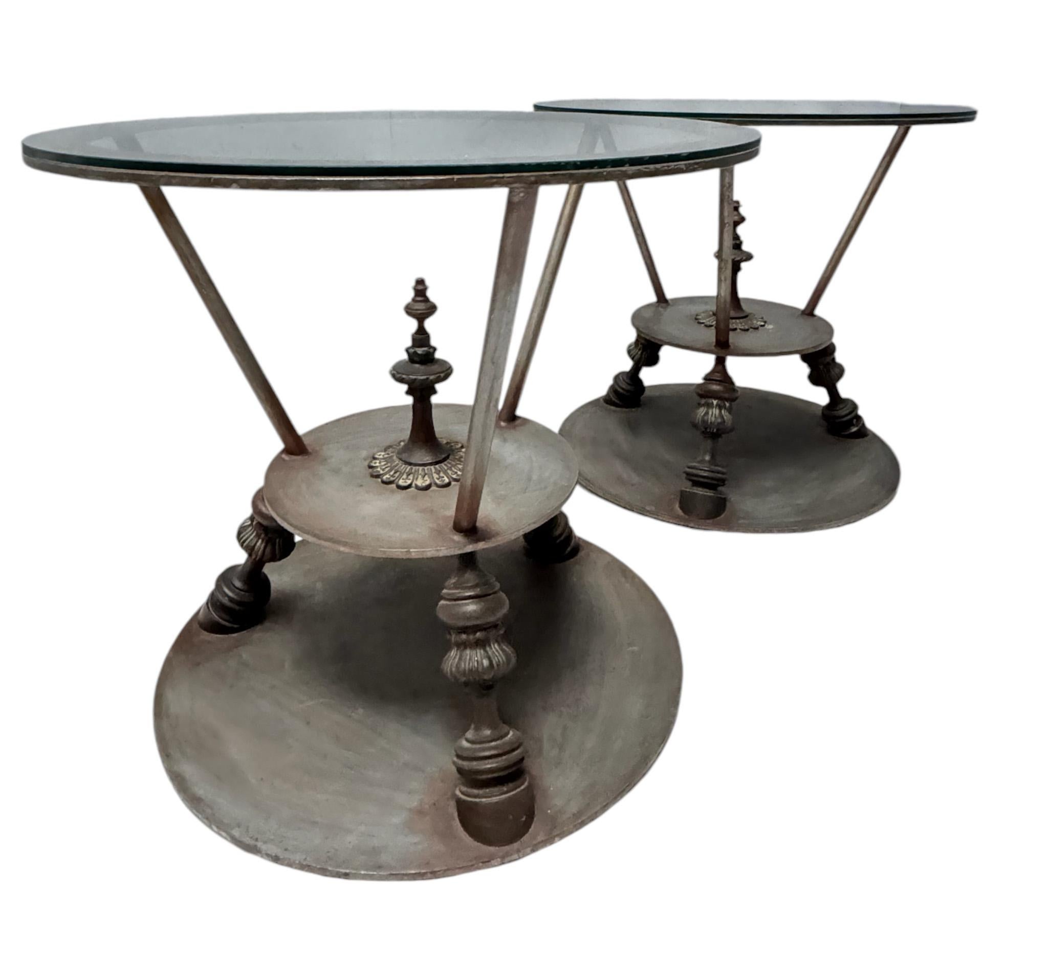Stunning and elegant pair of Hollywood Regency center tables.
Striking French design from the 1980s.
Patinated metal and bronze frames with original glass tops.
Real heavy pieces of furniture, 55 kg each!
This wonderful pair of Hollywood Regency