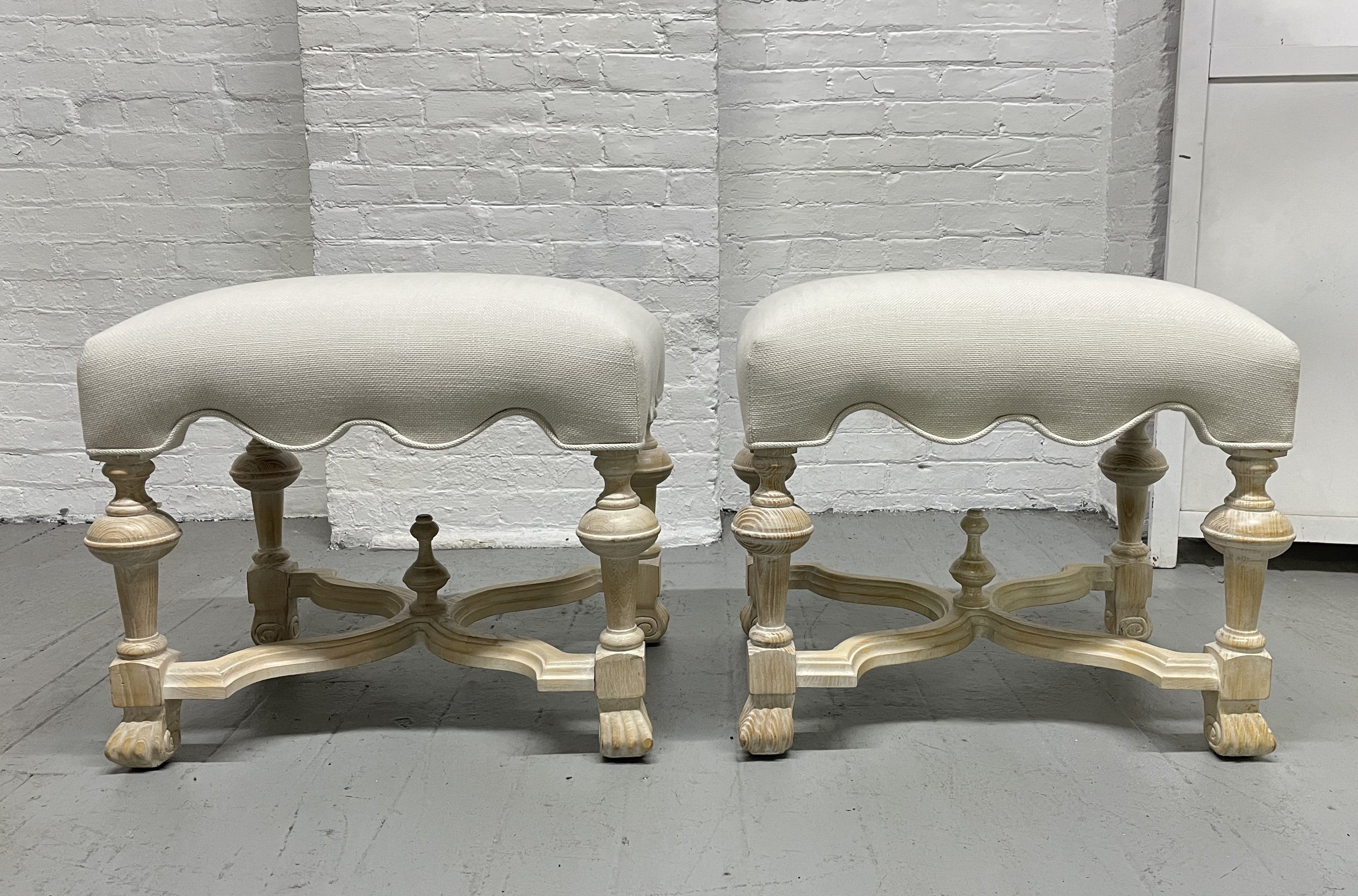 Pair of Hollywood Regency cerused benches. Nicely upholstered cotton-blend fabric.