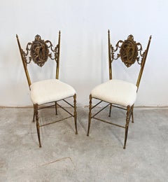 Pair of Hollywood Regency Chiavari Brass Side Chairs upholstered in boucle