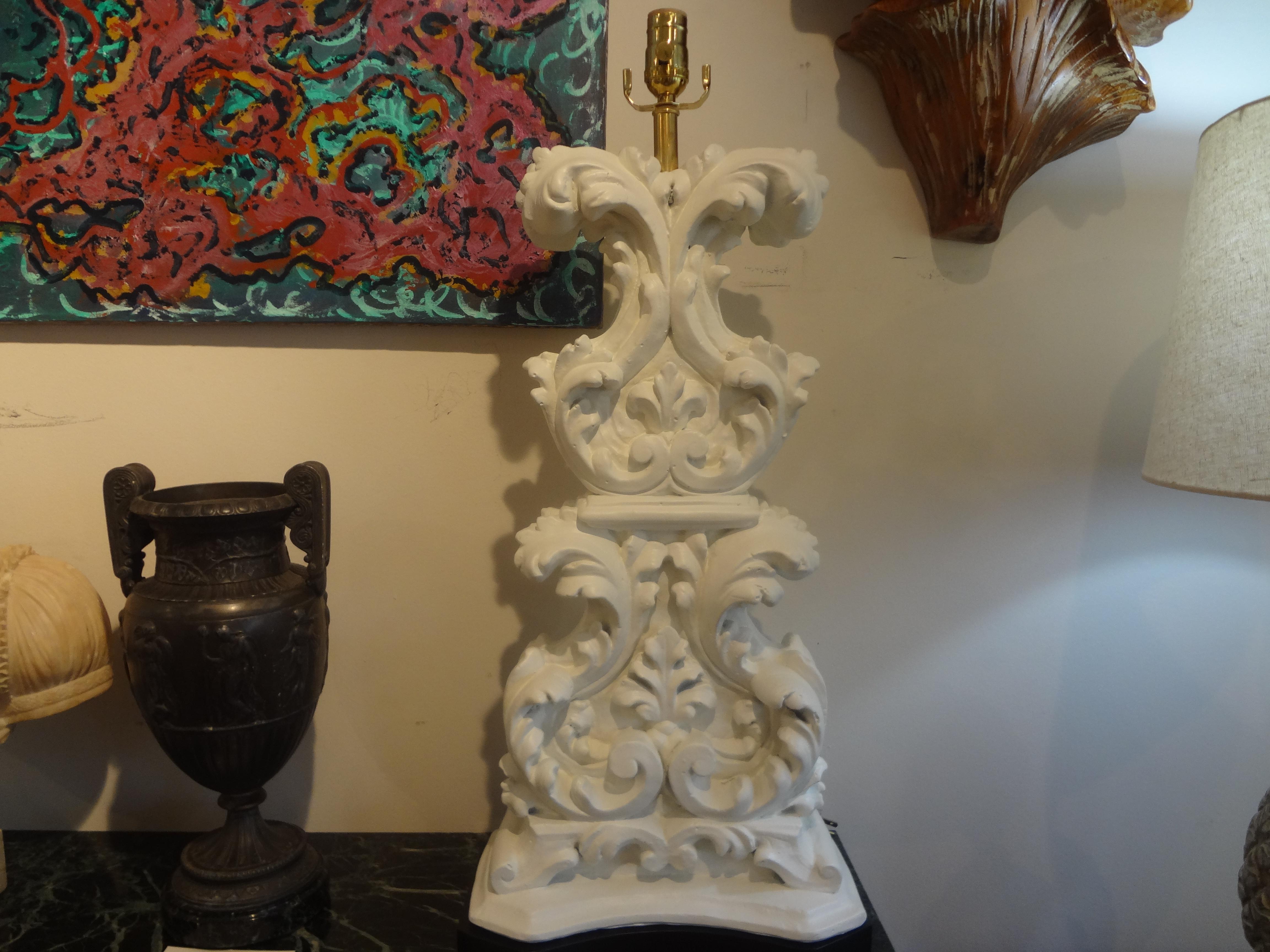 Pair of Hollywood Regency Dorothy Draper plaster lamps. Our stunning large scale heavy weight Hollywood Regency Baroque style plaster lamps on wood bases were executed in a cream white lacquer finish. These mid-century plaster lamps are newly wired