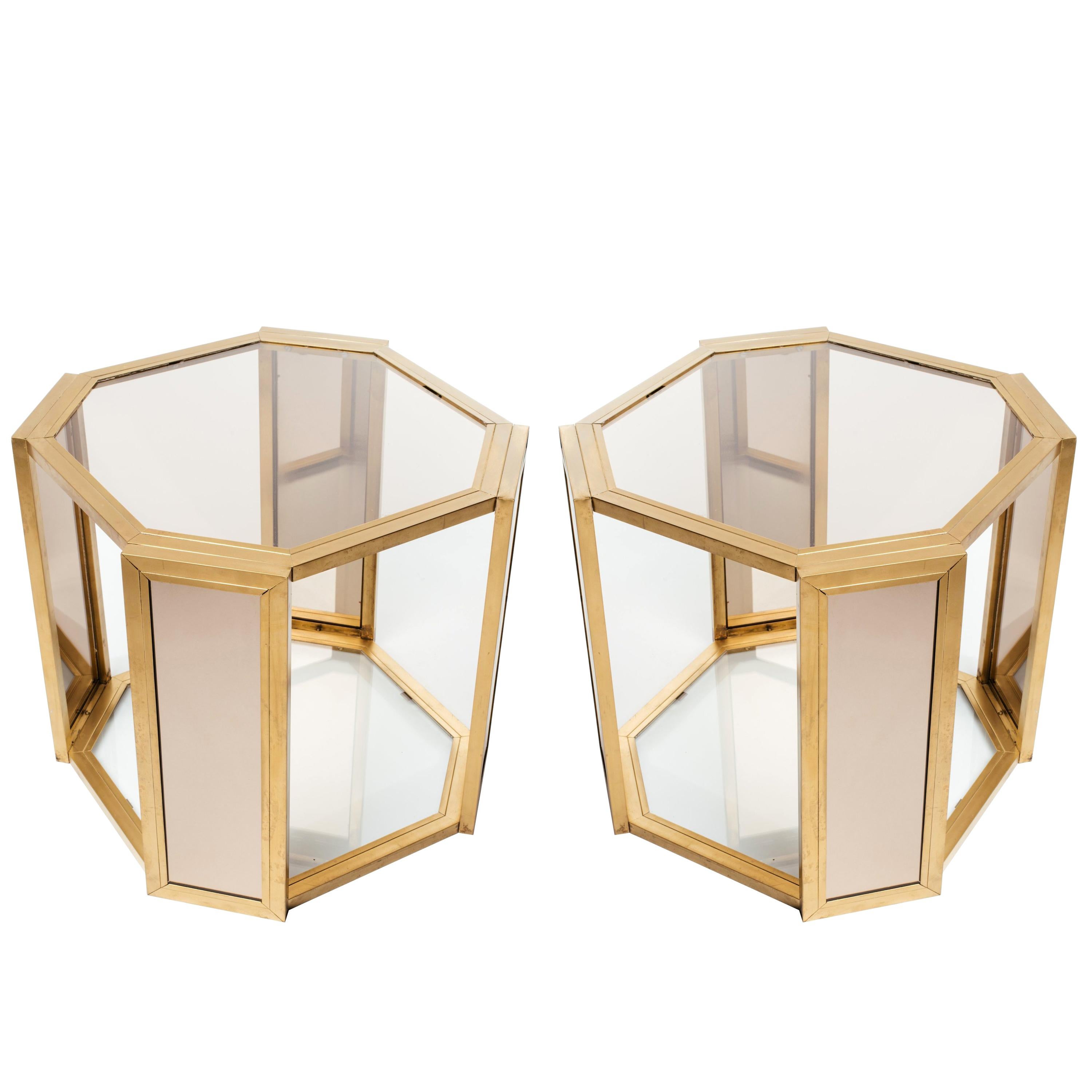 Pair of Mid-Century Modern two tier side tables with hexagonal forms. These chic end tables are comprised of dark brass metal frames with smoked glass tops and bronze mirrored insets on all legs.