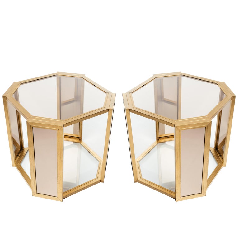 1970's Hollywood Regency side tables with hexagon form.  These chic end tables are comprised of dark brass metal frames with smoked glass tops and bronze mirrored insets on all legs.