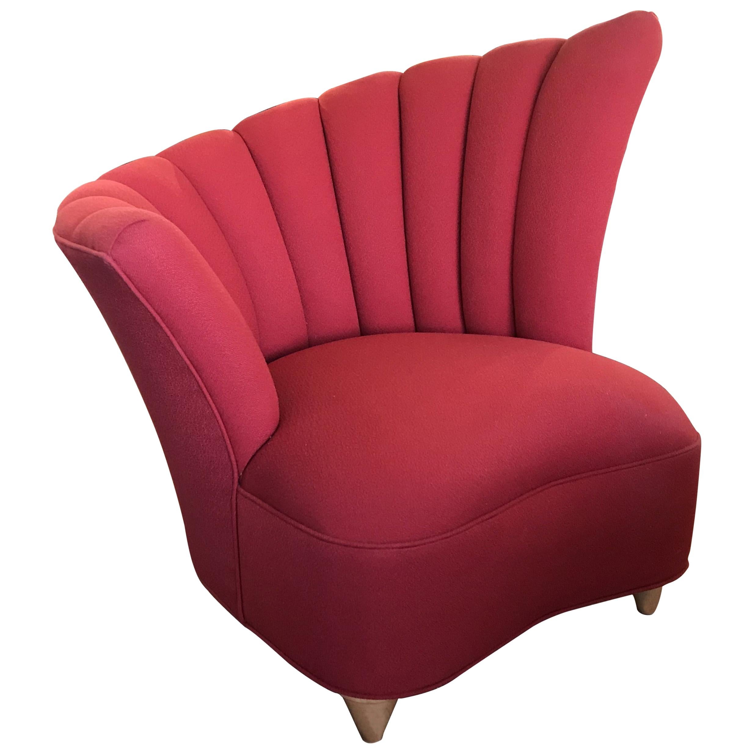 A pair of Hollywood Regency fan back chairs and an ottoman upholstered with channels in raspberry color fabric and sitting on 4 sycamore conic shaped legs.
The lower armrest is 26.50