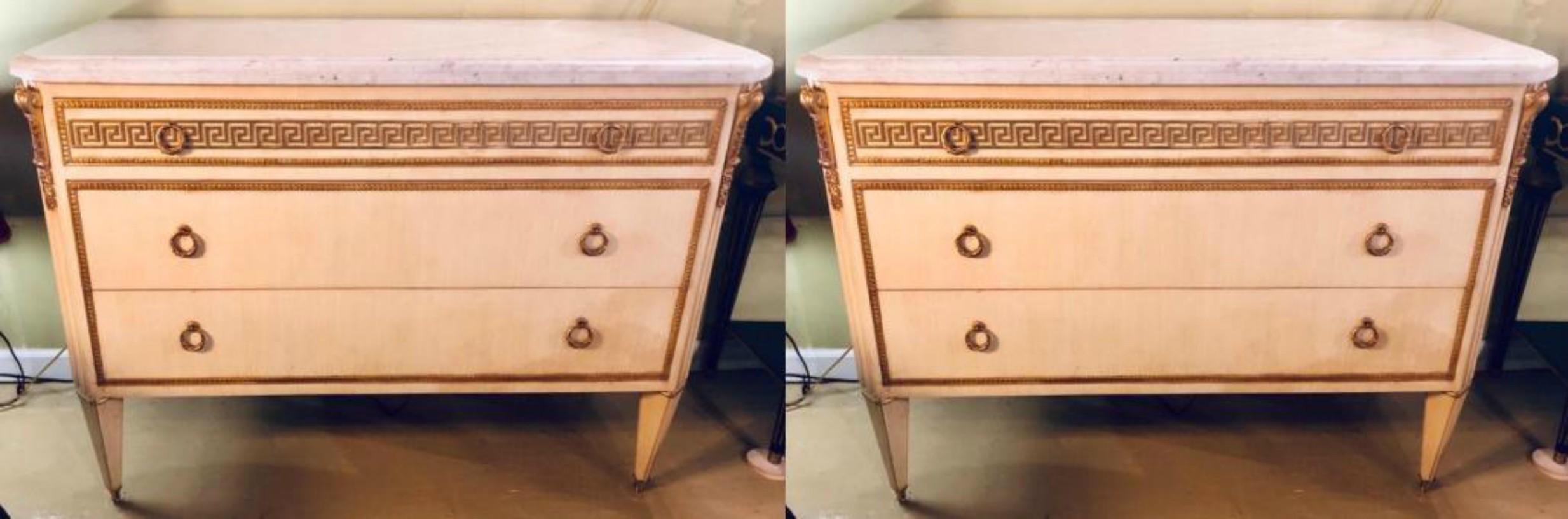 Pair of Hollywood Regency faux linen paint decorated Greek key design white marble-top commodes in the style of Maison Jansen. This fine pair of custom quality commodes are simply stunning and certain to light up and shine in any room in the