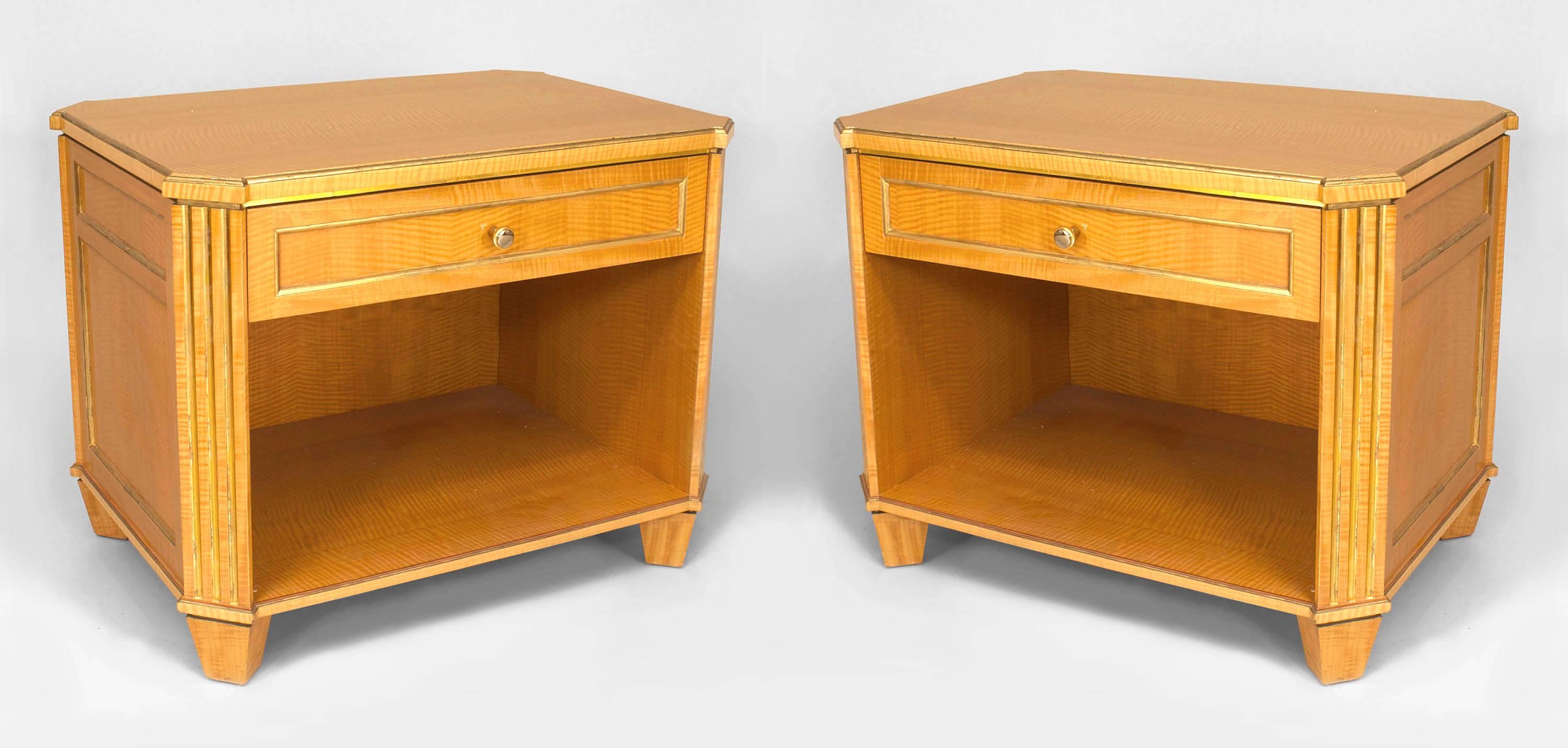 Pair of French Louis XVI-style (mid-20th Century) sycamore bedside commodes with a large open shelf under a single drawer with gilt fluted sides and trim. (PRICED AS Pair)
