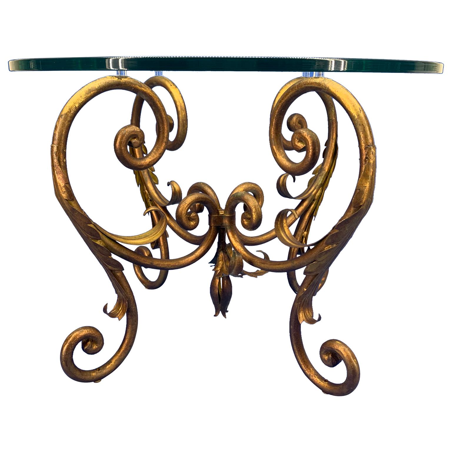 Italian pair of vintage scrolled Hollywood Regency style gilt iron and glass end or side tables.

Tables are solid metal, heavy and in good sturdy condition.