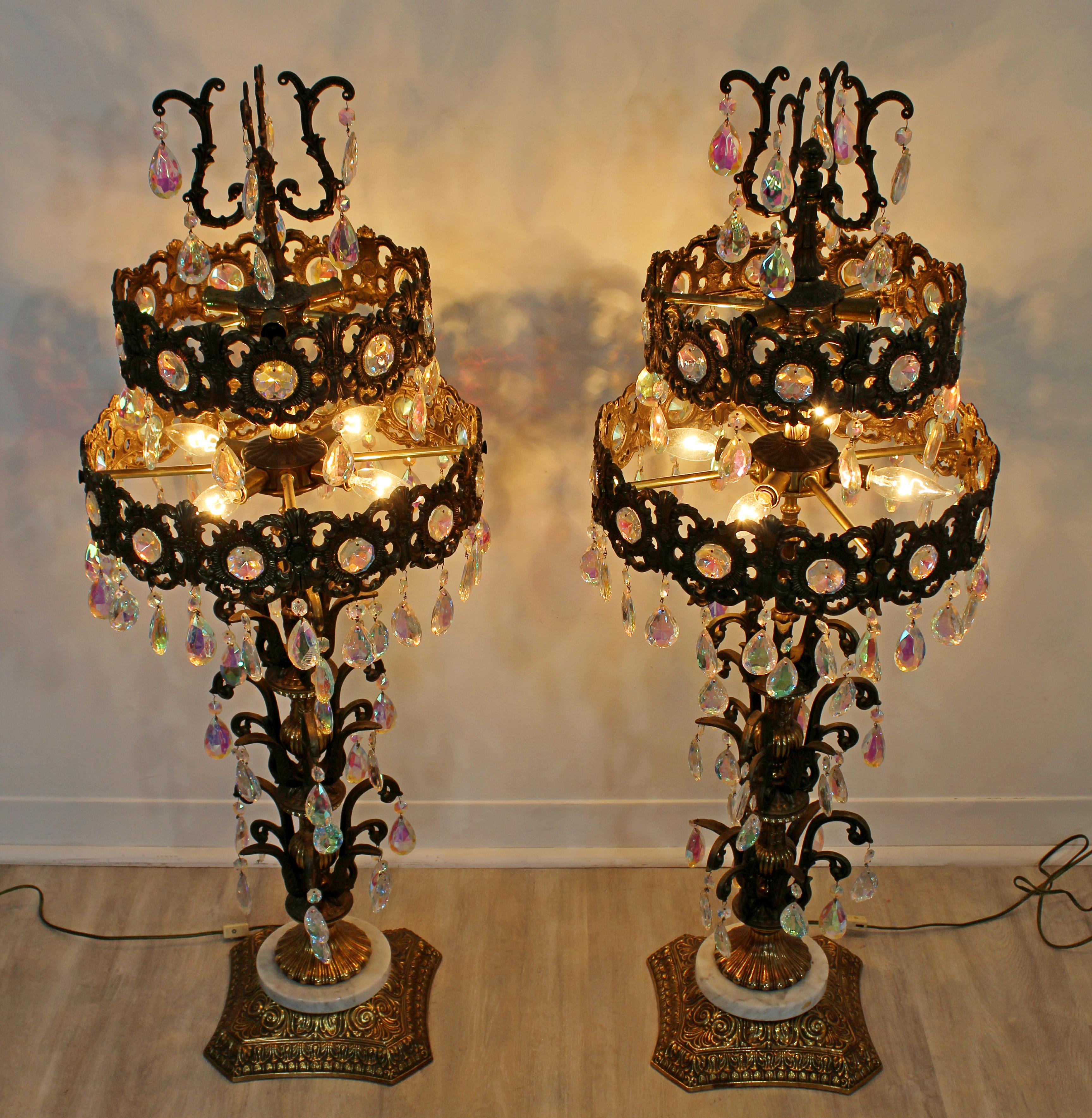 For your consideration is a phenomenal and large pair of Italian Hollywood Regency, tiered prism metal table lamps. In excellent condition. The dimensions are 15