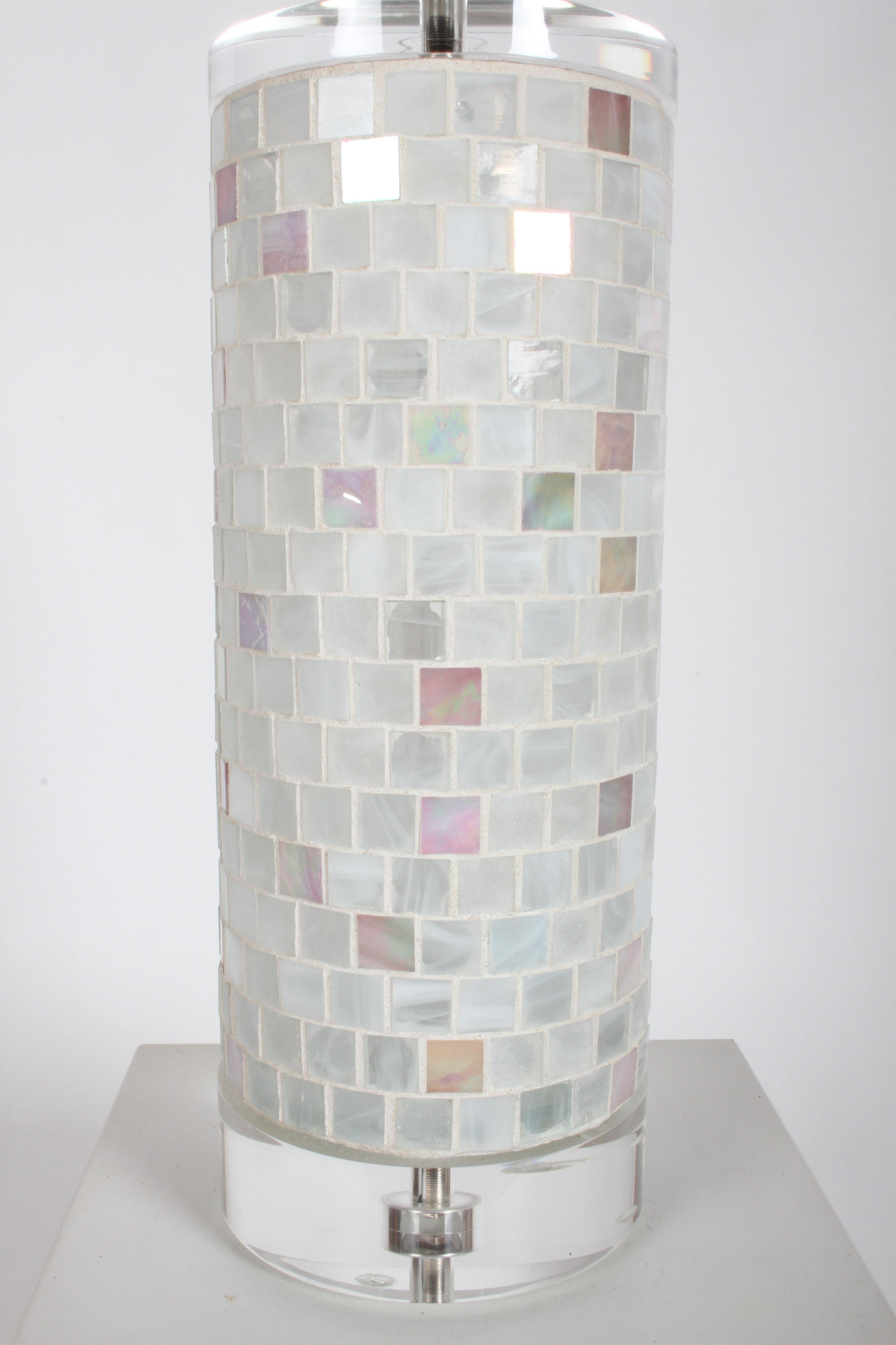 Pair of late 1970s or early 1980s Lucite cylinder form lamps with Italian Murano glass mosaic tiles around standard of lamps. No loose or broken tiles, Lucite has lite scuffs. Some tiles are iridescent, others are opaque. Has thick Lucite base and
