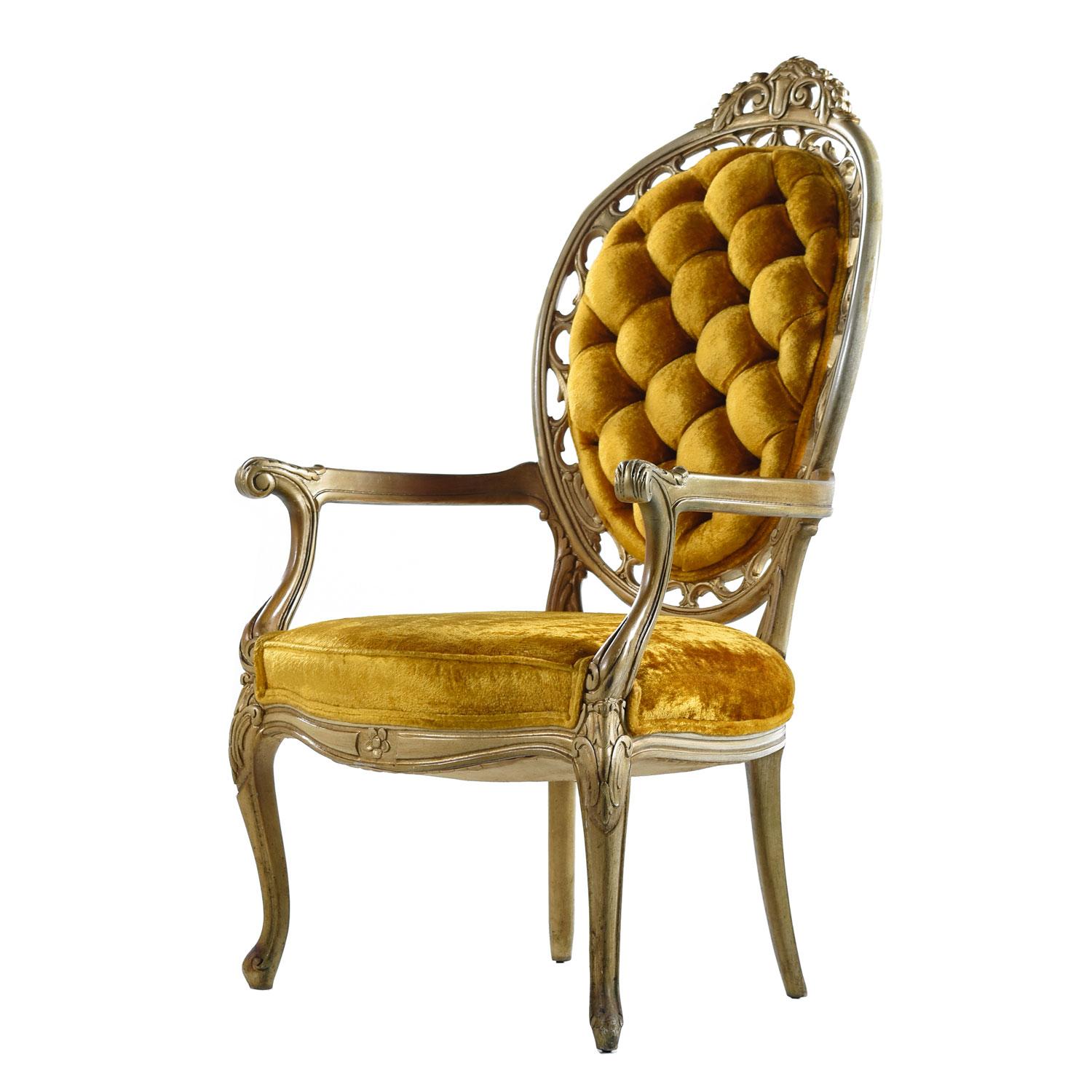 Brash, super-plush and regal with no apologies. Vintage 1960s marigold gold velvet colored armchairs. A harmonious and glitzy blend of Rococo, Hollywood Regency and Louis XV styles. Dozens of beautifully tailored, deeply tufted buttons. The carved
