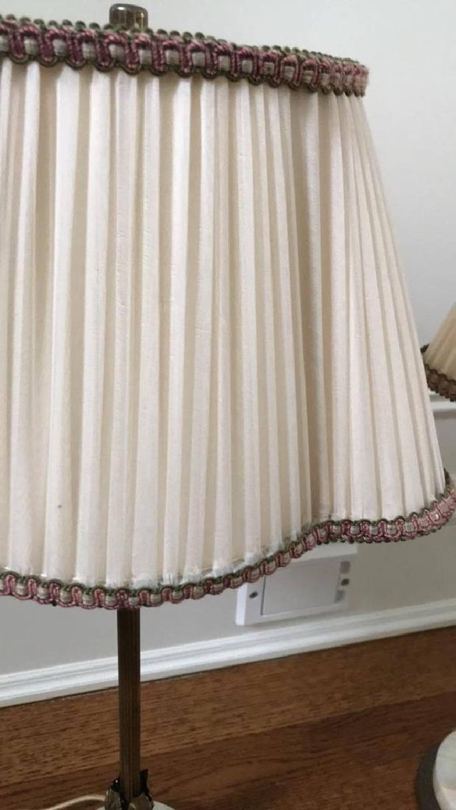 Pair of elegant French style boudoir bedroom lamps with slender fluted stem and acanthus at the end mounted on round marble base with silk shades. Dimensions: H 22