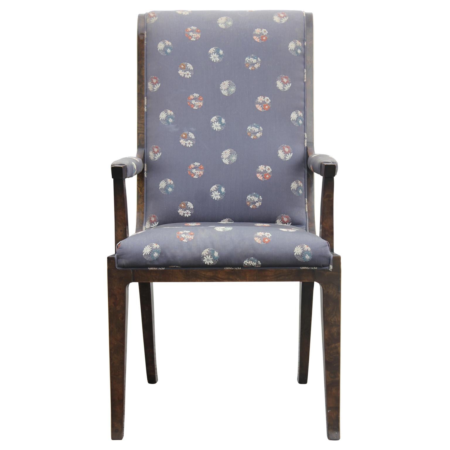 Mastercraft Hollywood Regency chairs with armrest. The pair has a blue fabric with floral circle prints. The wood is Carpathian elm. The pair of chairs is designed by William Doezema for Mastercraft.
