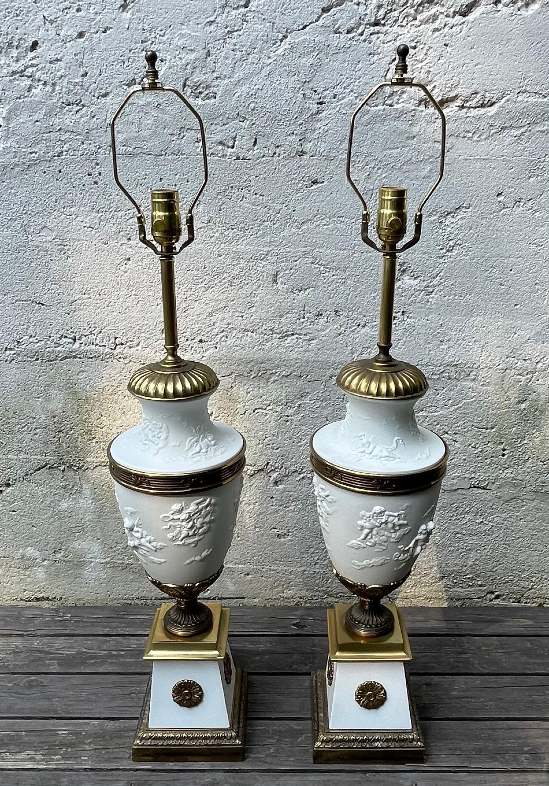 Beautiful pair of Hollywood Regency matte white porcelain table lamps with brass hardware.  Porcelain is from Bavaria and assembled by Westwood Industries, Patterson NJ.  
30.50 inches to the top of socket, shade and finial not included.