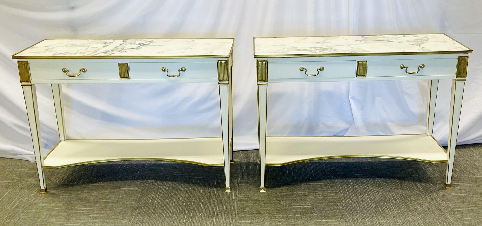 Pair of Hollywood Regency Neoclassical White Sofa or Console Tables, Sideboards or Serving Tables, Manner of Maison Jansen
This very versatile Pair of Hollywood Regency neoclassical white paint decorated console or sofa tables in the manner of