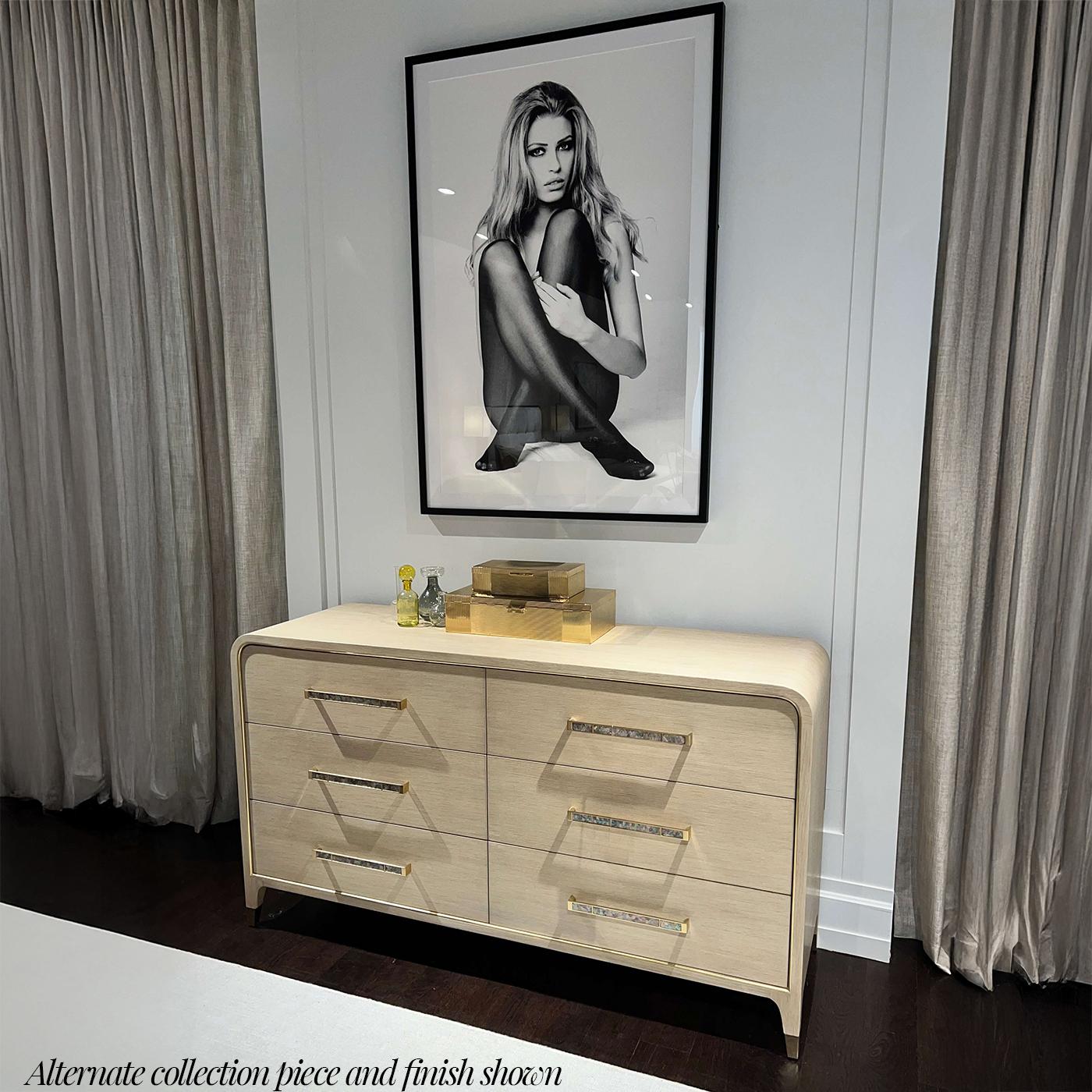 Meticulously artisan made and finished in light wood martini finish it pairs effortlessly with the matching dresser or bed as a luxurious statement piece for those who embrace an elegant approach to life.

Three drawers offer convenient storage,