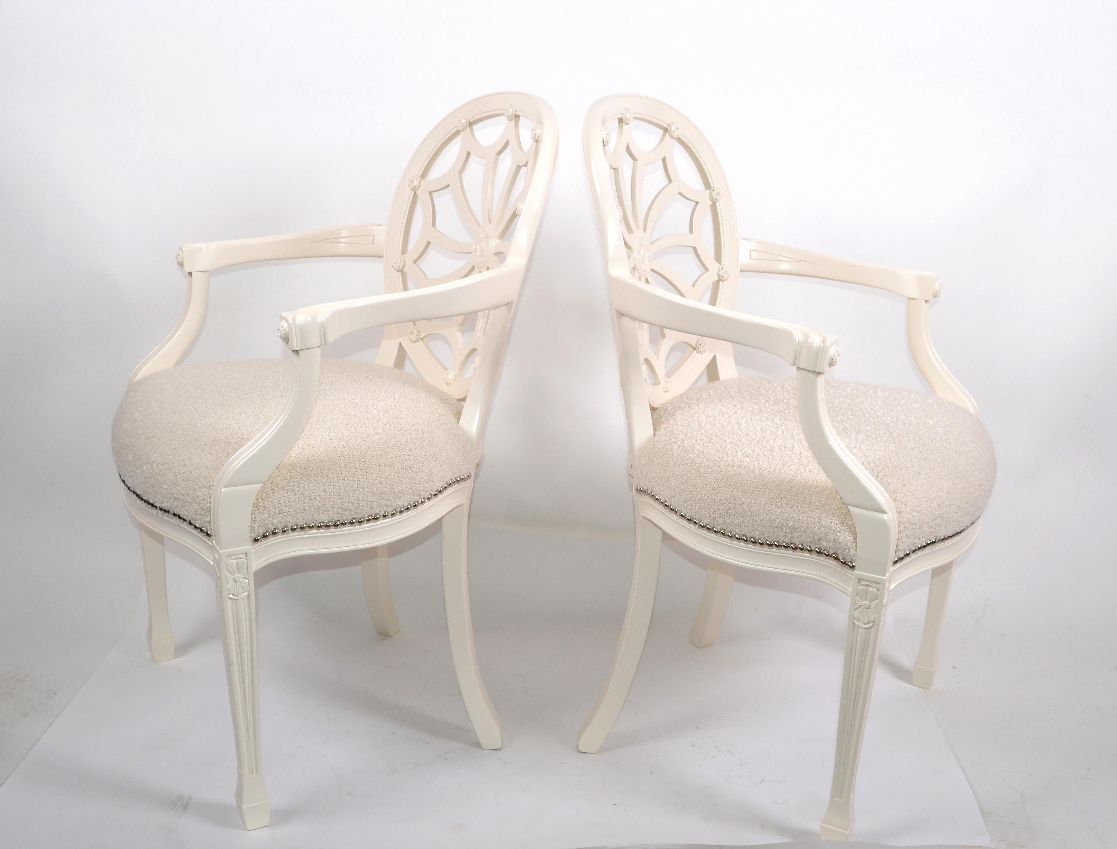 Pair of Hollywood Regency off white wooden ornate armchairs in beige Bouclé fabric seat.
Very detailed carved Medallion back and studded seat.
The set is restored and ready for a new Home.
Measure: Arm height 27.5 inches.