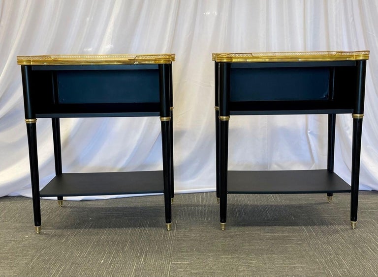 Pair Hollywood Regency Ebony Nightstands, End Tables or Chests in the Manner of Maison Jansen
 
Pair of ebony neoclassical open nightstands or end tables in the manner of Maison Jansen. These finely crafted open end tables are simply stunning. The