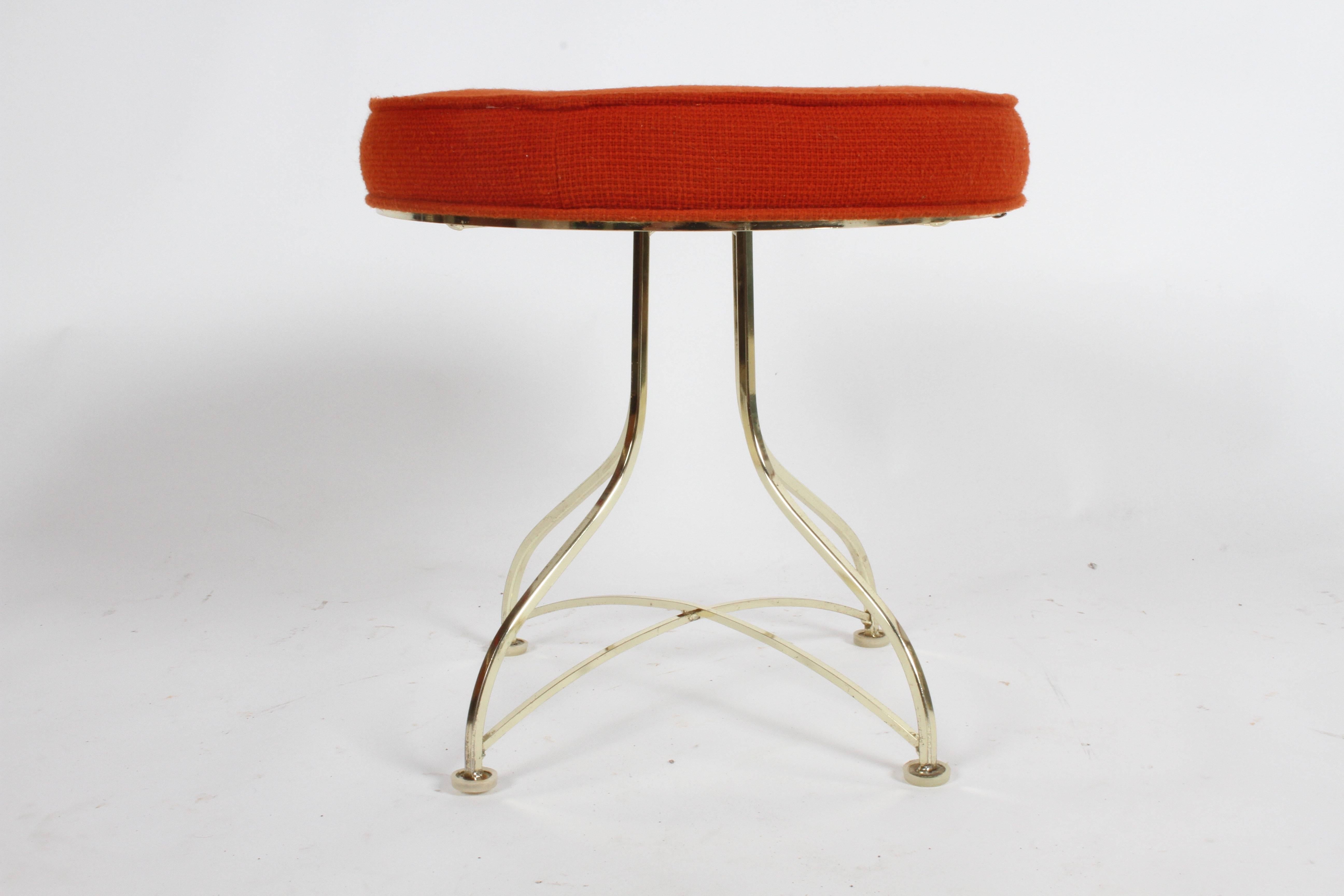 Pair of midcentury round stools or ottomans with tufted round seats and plated brass legs. Upholstery needs to be updated, shows stains. Brass plating has minor patina.