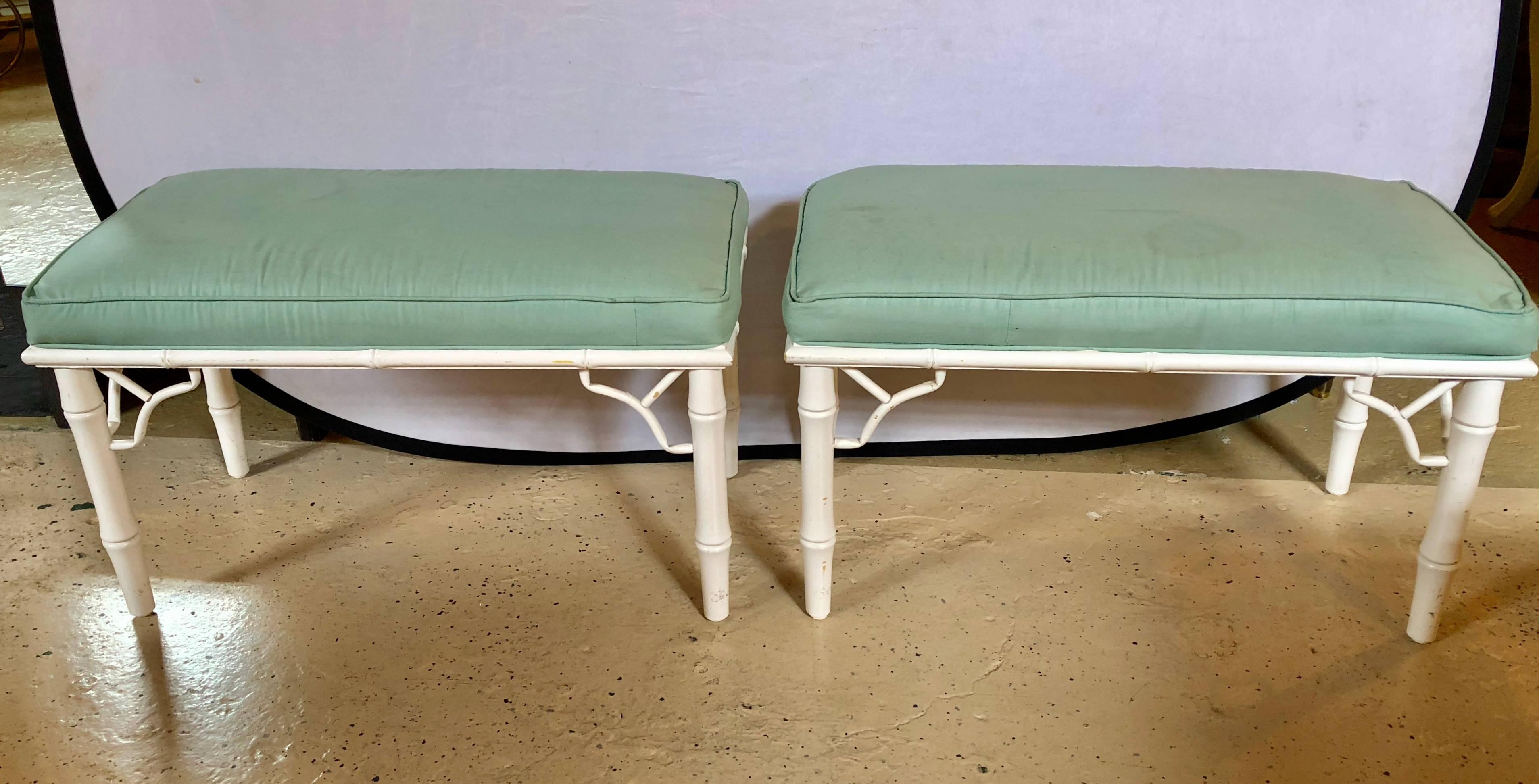 Pair of Hollywood Regency style bamboo form benches each stylish in form and painted design. The green fabric with simple stains.