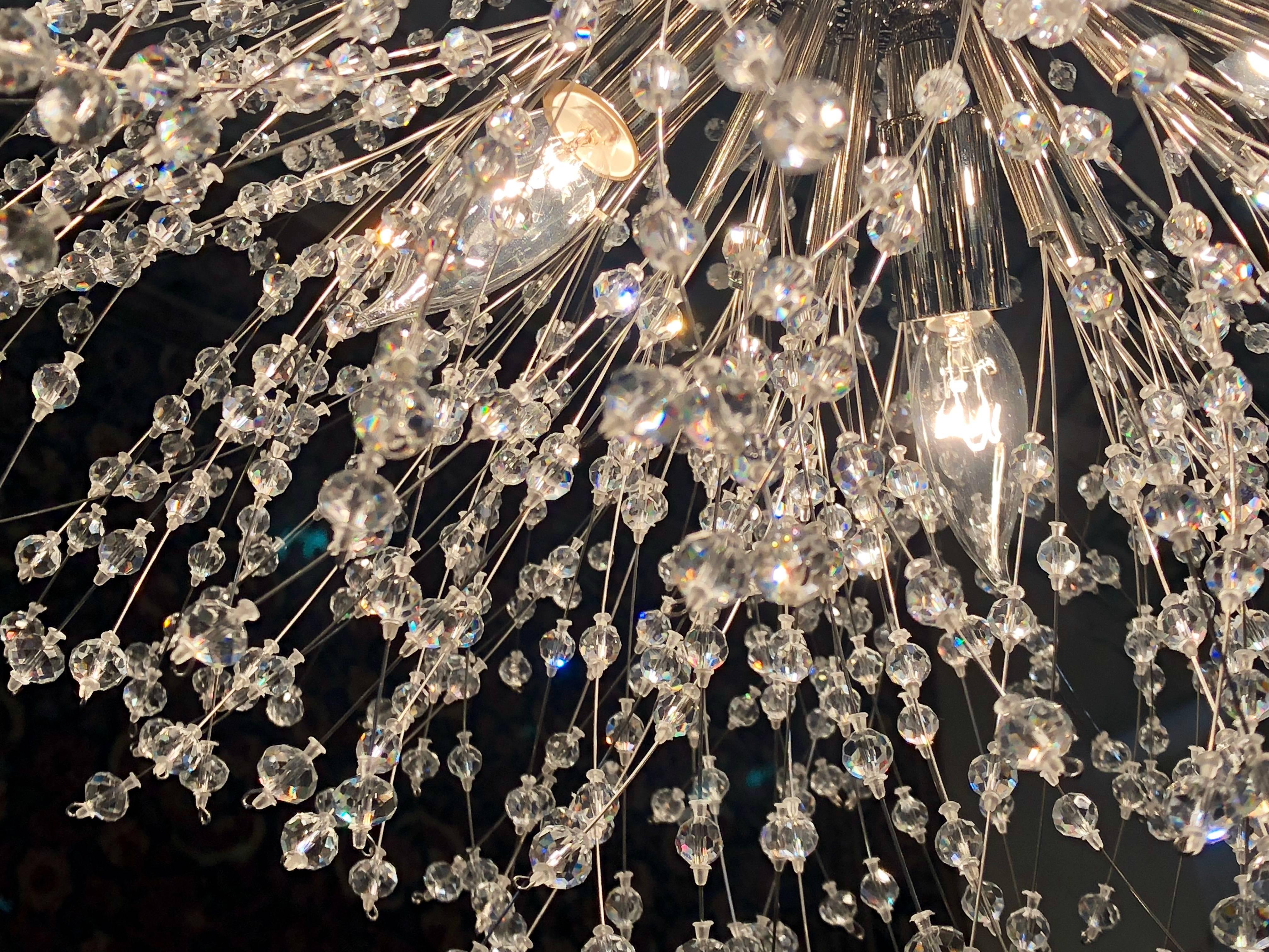 Pair of Hollywood Regency Style Circular Chrome and Crystal Sputnik Chandeliers In Good Condition In Manhasset, NY