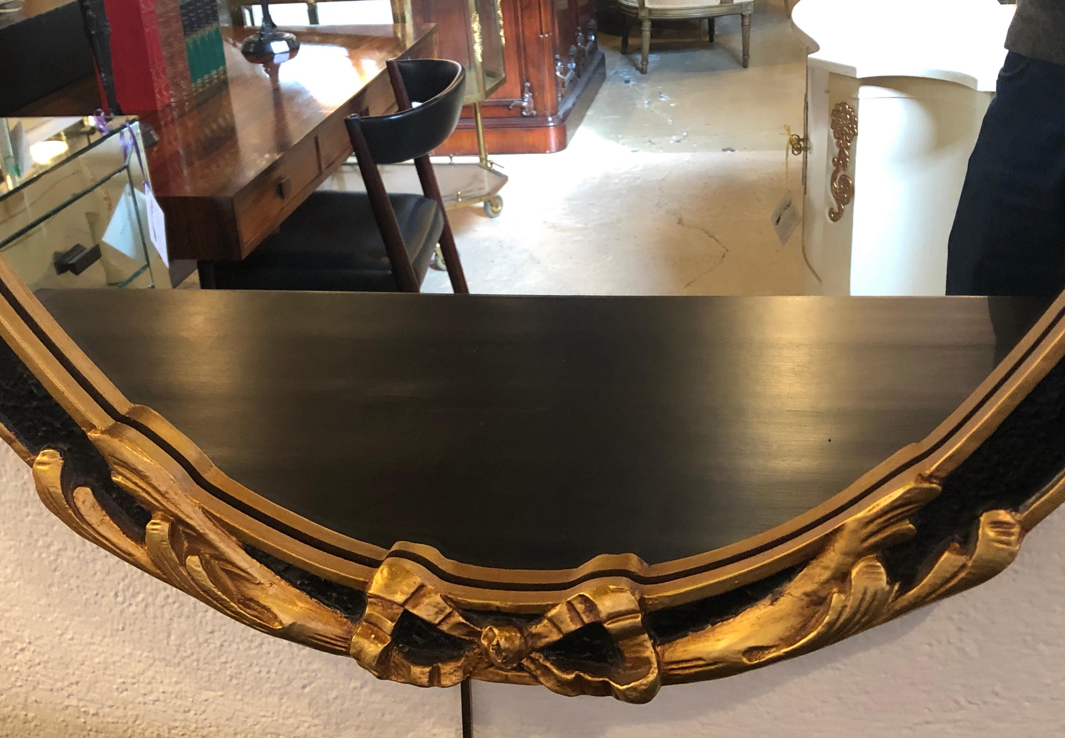 Pair of Hollywood Regency Style Ebony and Gilt Wood Wall or Console Mirrors 6