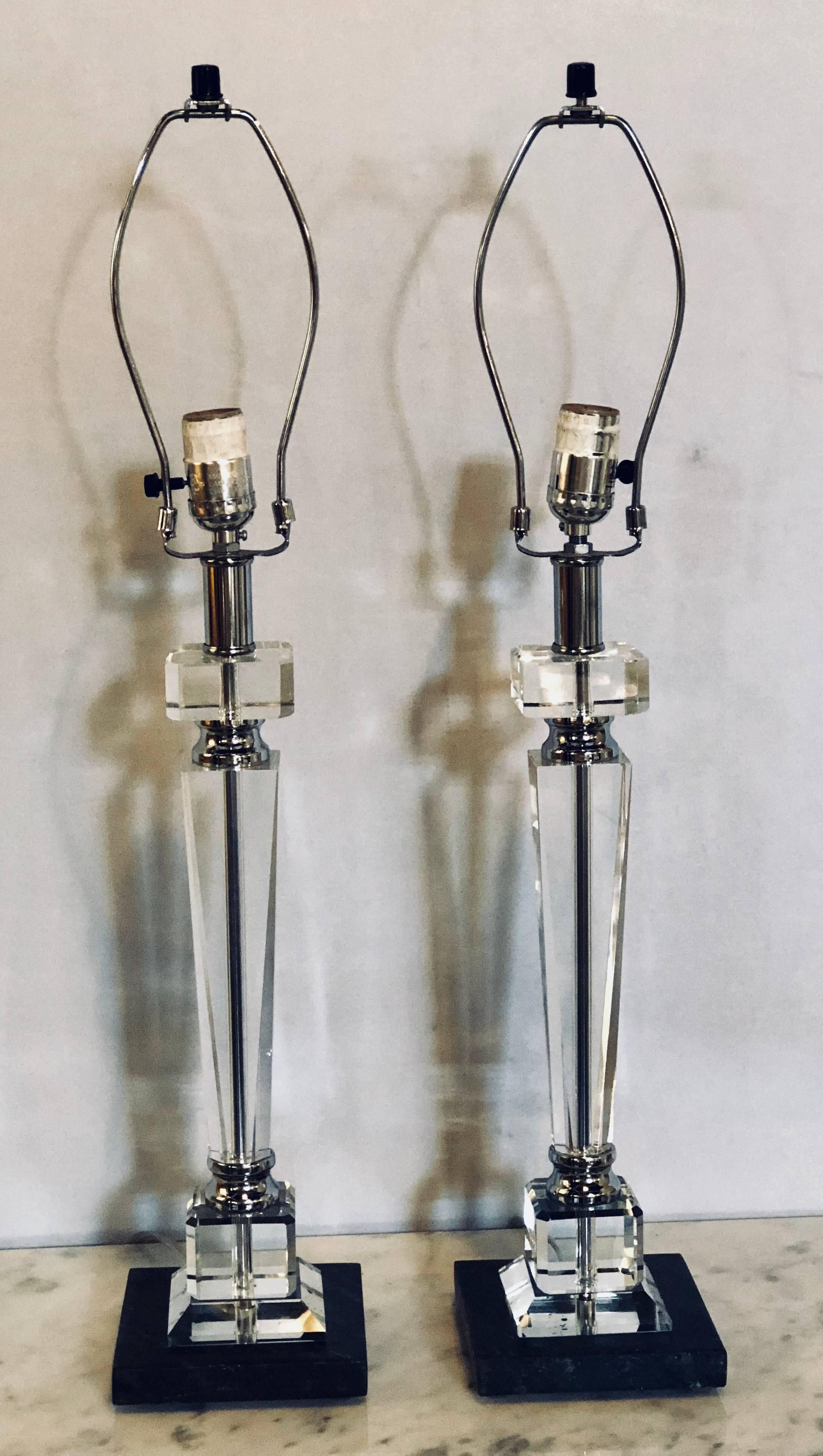 Pair of Hollywood Regency style glass and chrome table lamps in column form.