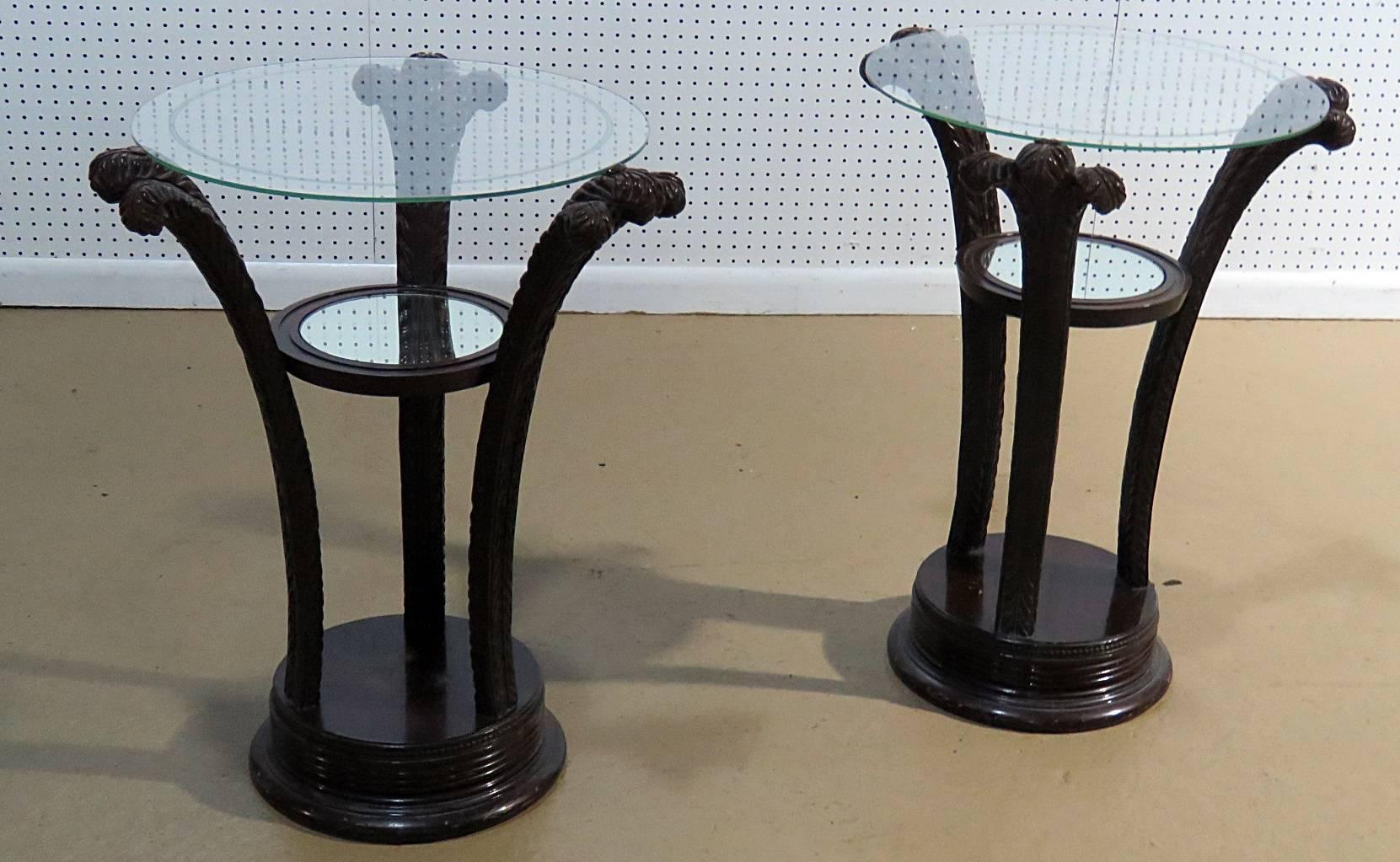 Pair of Hollywood Regency style glass top end tables with Prince of Wales feather style bases.