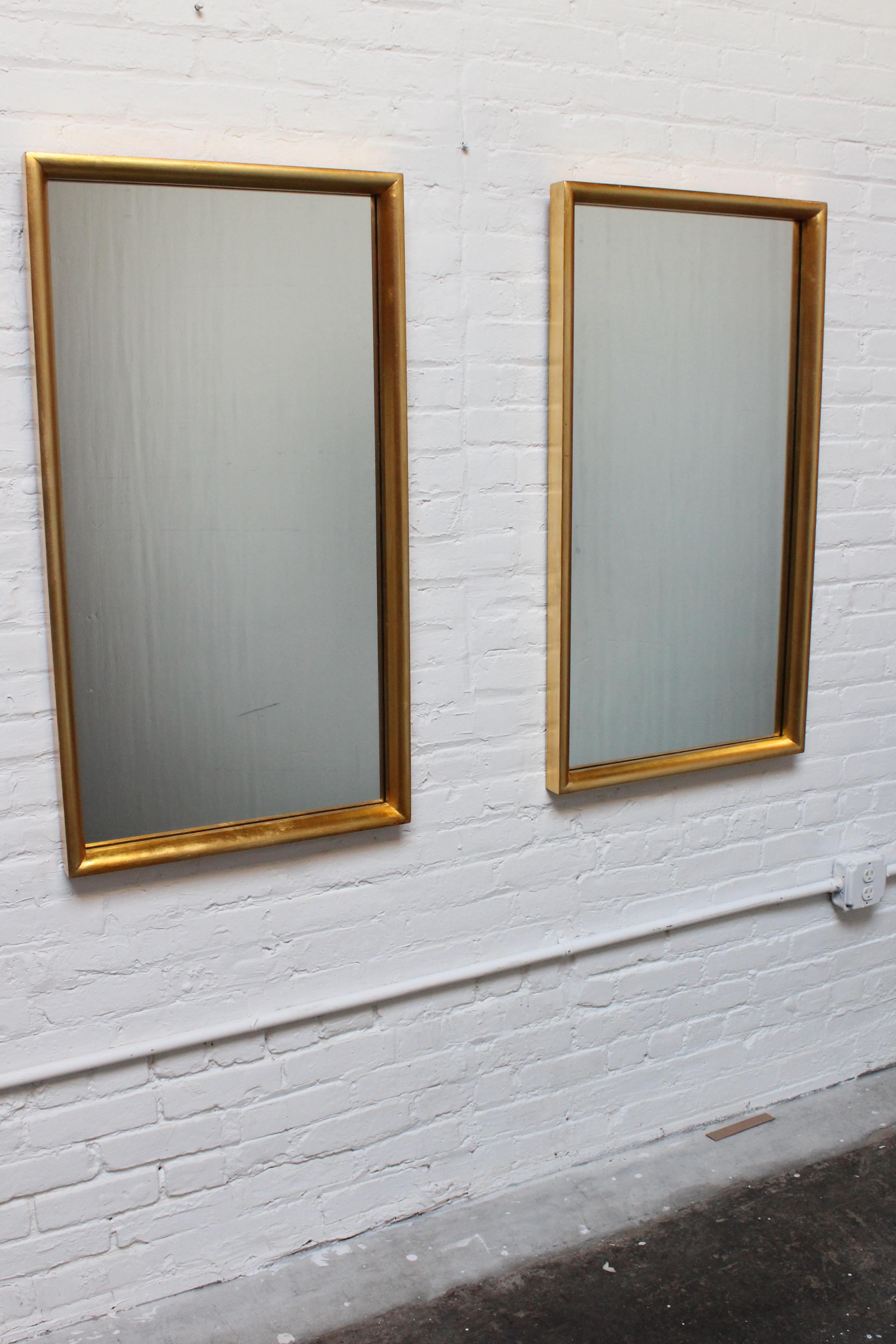 Pair of rectangular Labarge mirrors with inset glass within deep, gold leaf / giltwood frames. Light wear to the gilt, as shown; the mirrors themselves are clean sans two small scuffs to one of the glass panels about 0.25