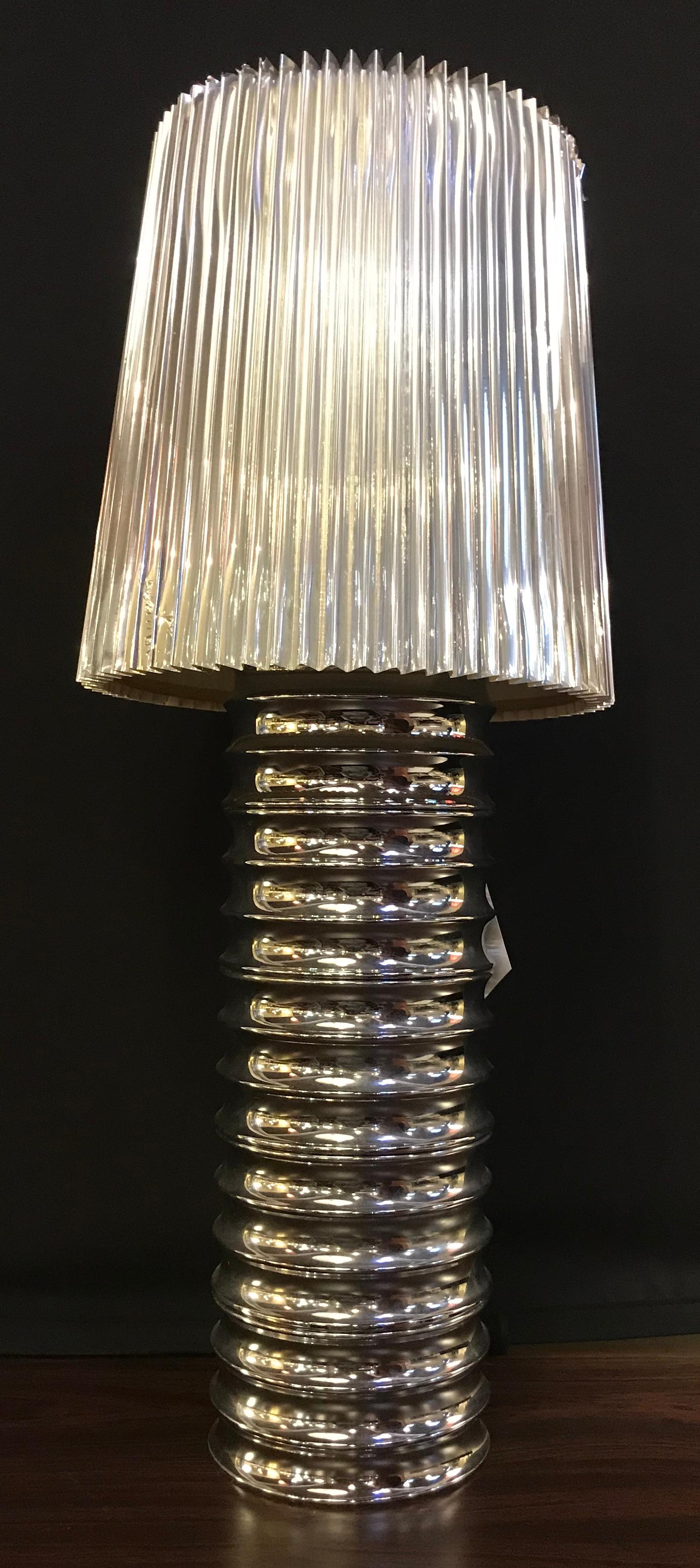 Pair of silvered mercury glass table lamps each taking one sixty watt light bulb with harps and custom shades.