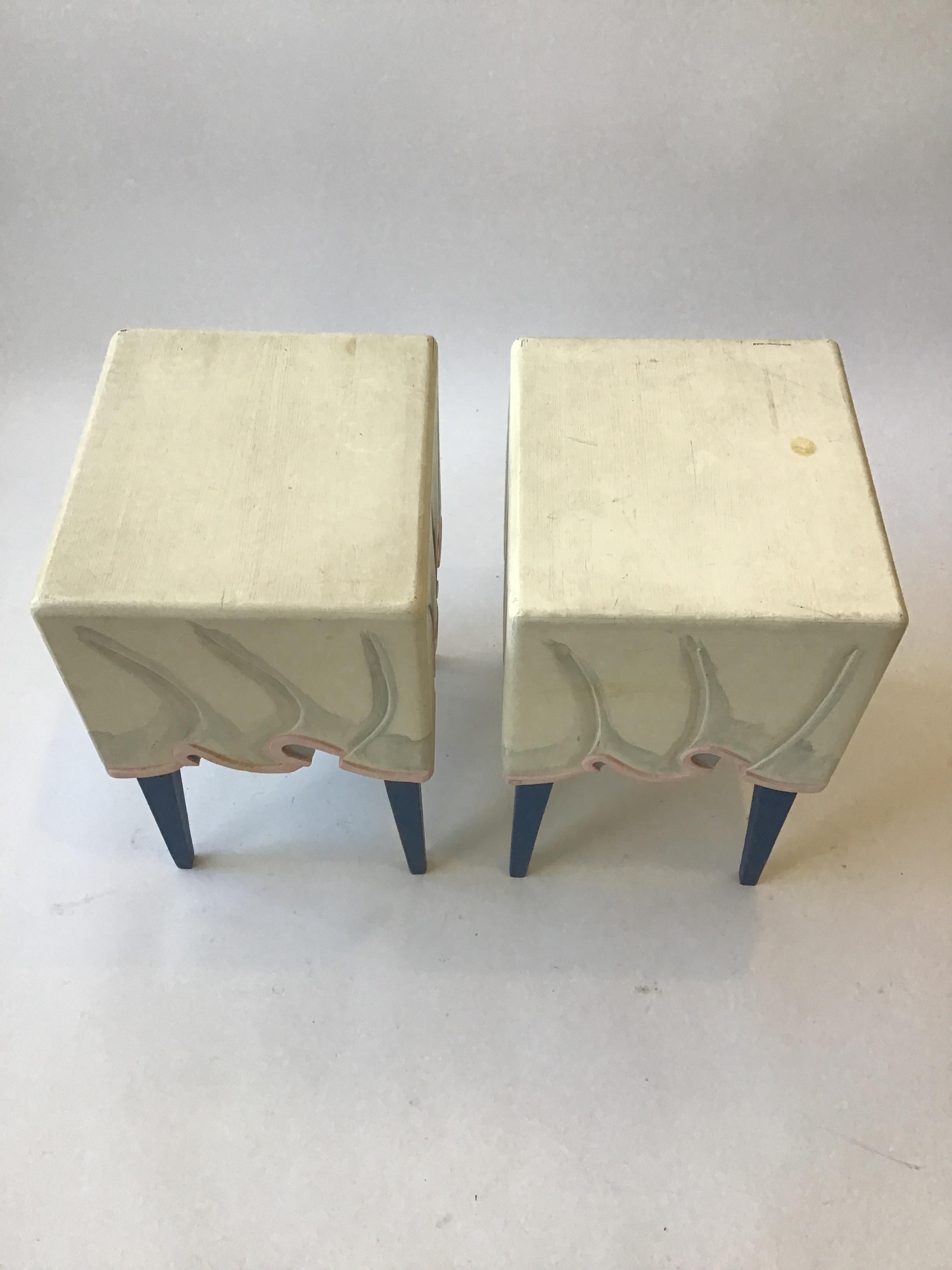 Pair of Hollywood Regency style, hand carved wood, painted side tables, to appear to be draped in fabric.