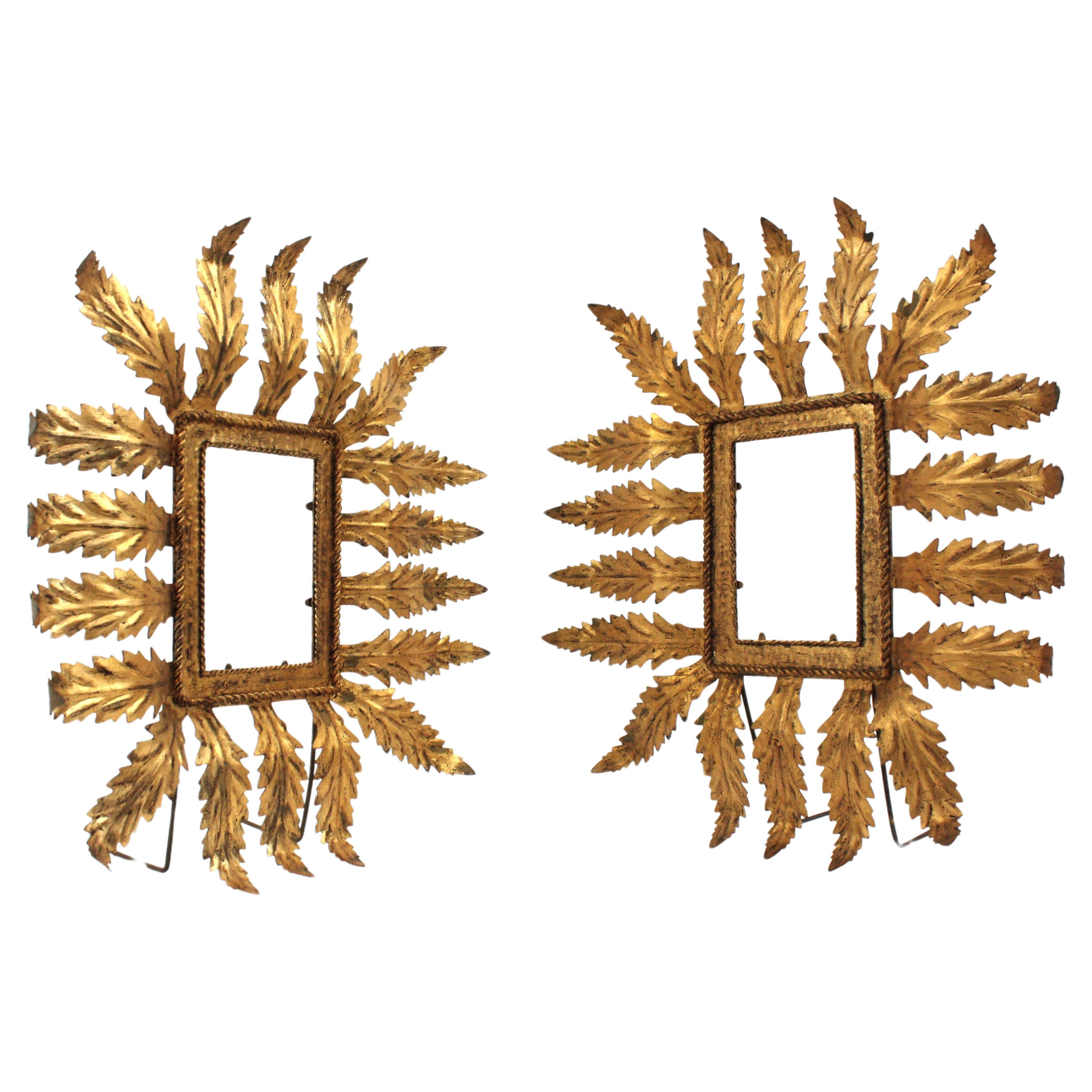 Sunburst Rectangular Tabletop Picture Frames in Gilt Metal, Spain, 1940s.
Pair of hand-hammered iron sunburst frames with leaves surrounding the picture and gold leaf finish
To be used vertically. Standing as easels. No glass.
Original gold leaf