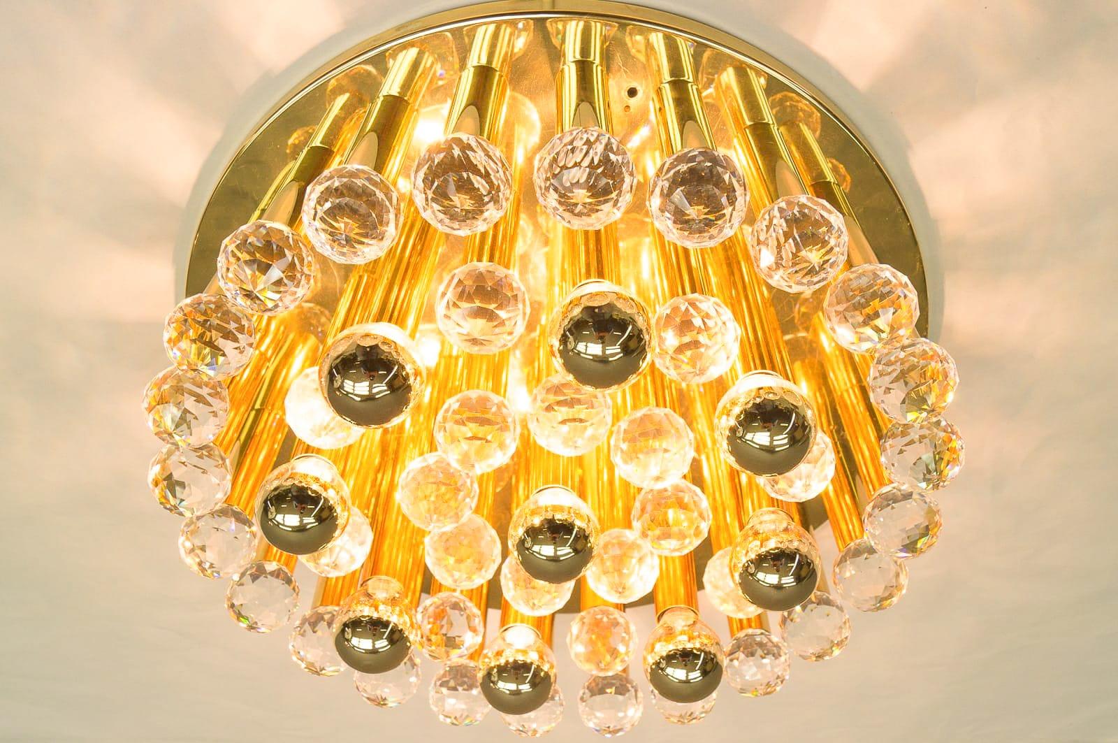 Pair of Hollywood Regency ceiling lamps by Ernst Palme from the 1960s. Features handcrafted cut crystal glass spheres, easy to install, fixing two screws to the ceiling, structure made from metal and brass, number of lights: 9 x E14 Edison screw -