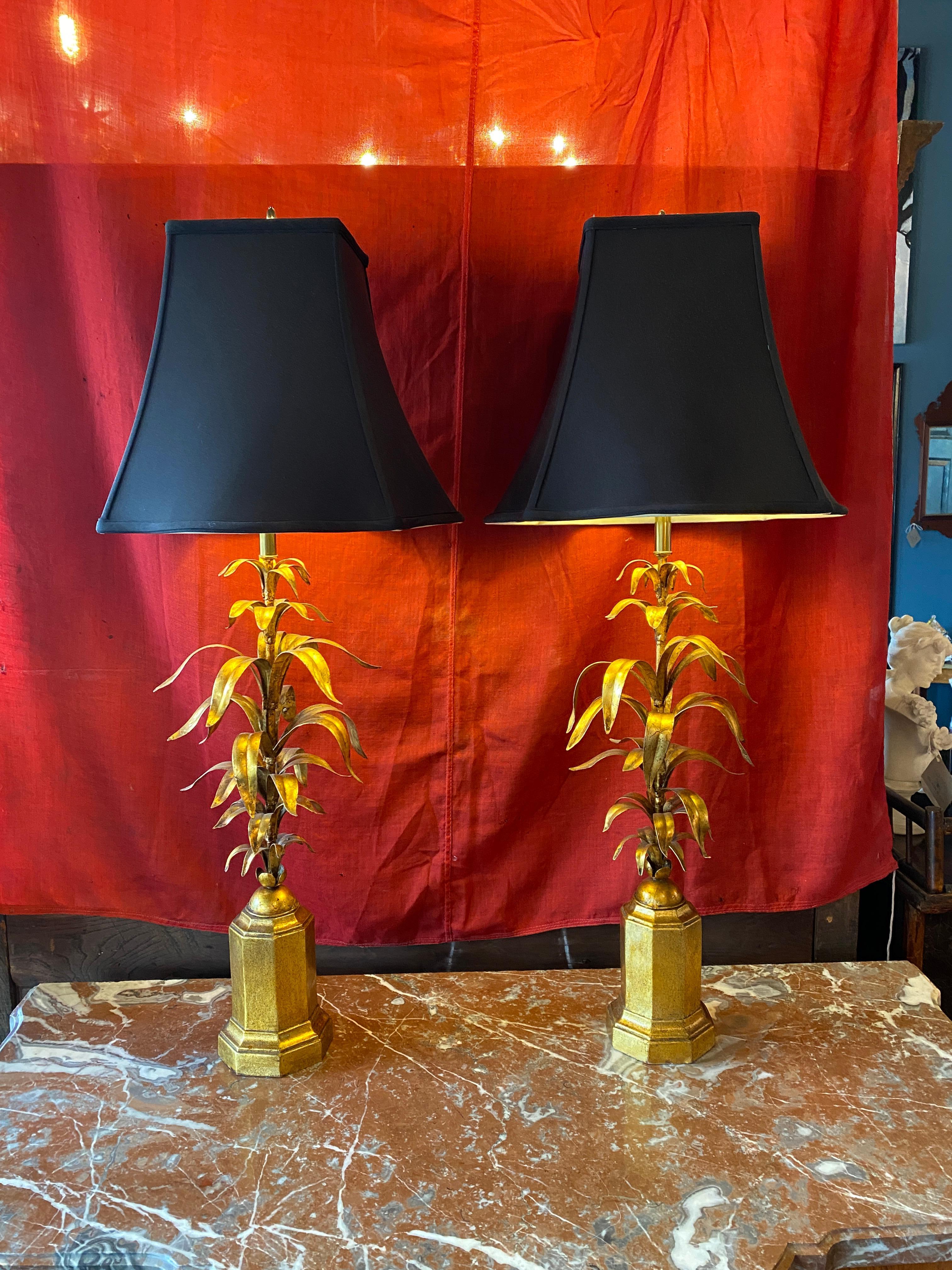 This is a gorgeous pair Hollywood Regency wheat form gilded table lamps. 
Measures: Lamps are 38