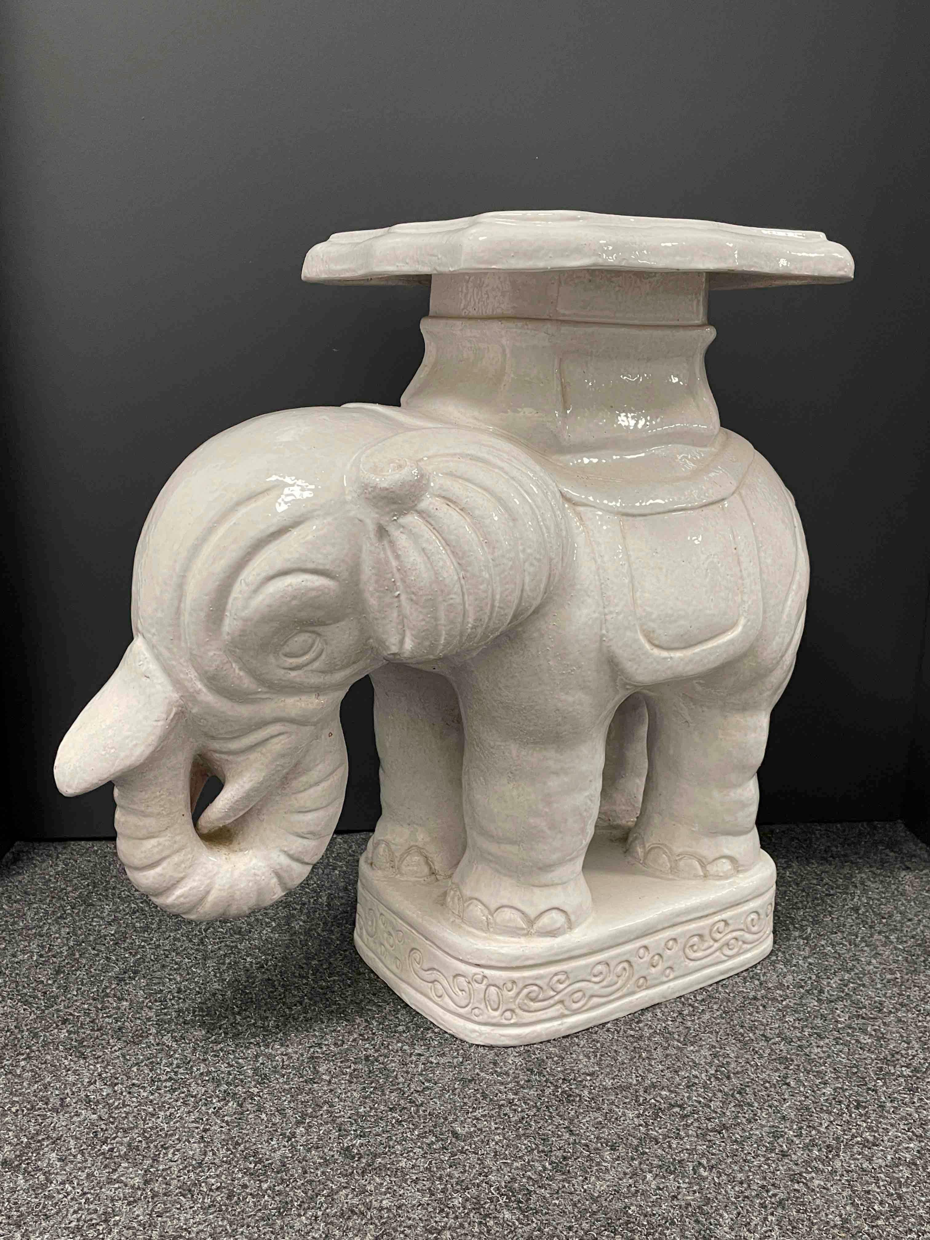 A pair of mid 20th century glazed ceramic elephant garden stool, flower pot seat or side tables. Handmade of ceramic / earthenware / majolica. Nice addition to your home, patio or garden. A nice addition to any room, patio, pool area or yard.
  