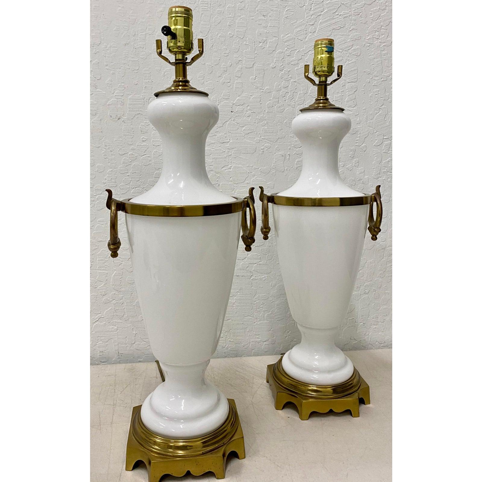 Pair of Hollywood Regency white glass with brass mounts table lamps, circa 1950

Gorgeous pair of vintage table lamps.

7